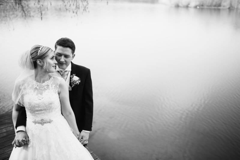 Bride And Groom By Lake Nunsmere Hall