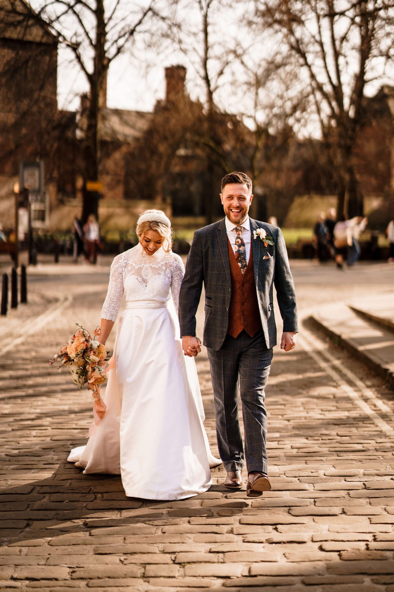bride and groom walking around York Minster