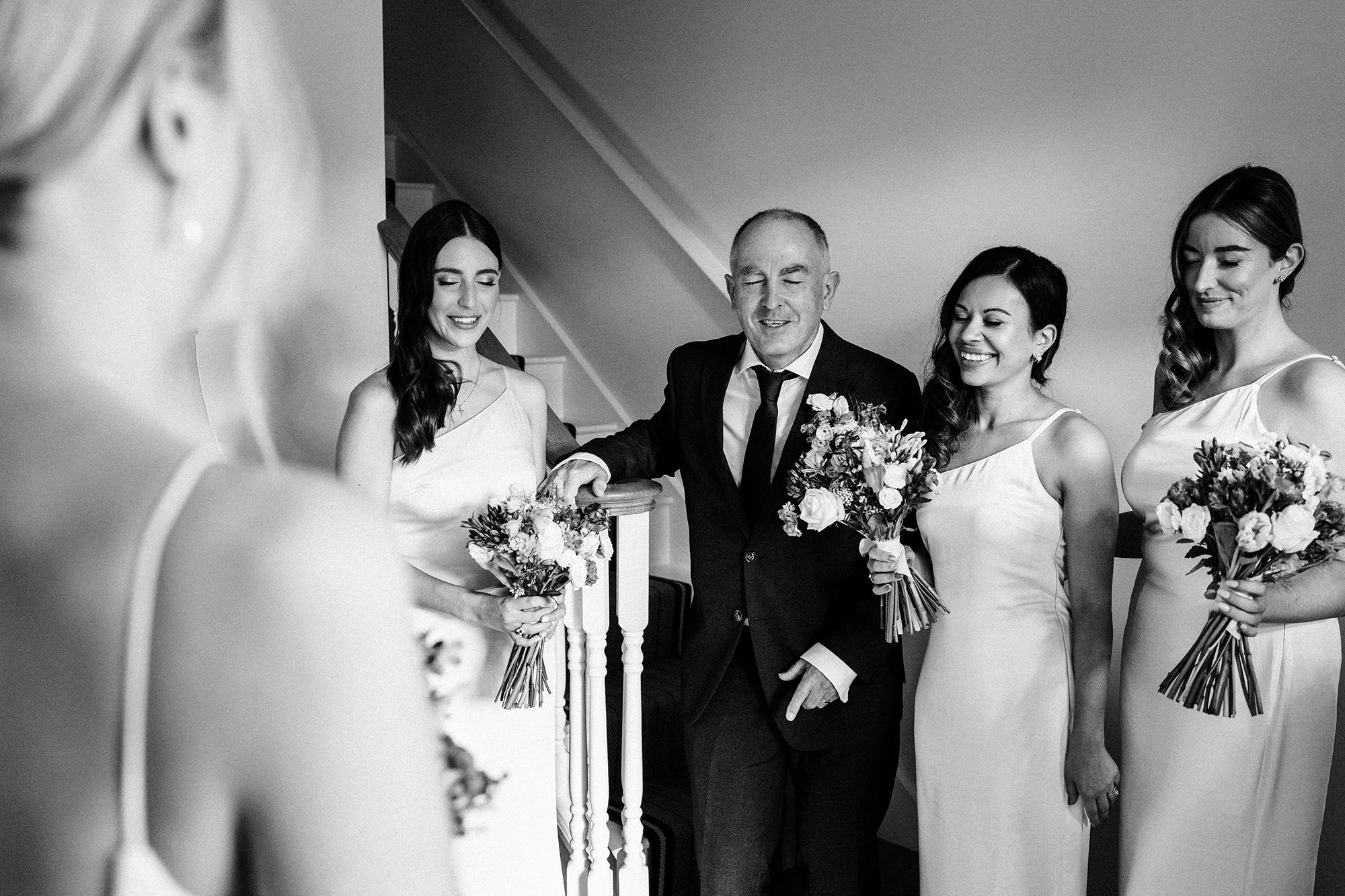 Bride reveals wedding dress to father and bridesmaids before ceremony at Primrose Hill Farm.