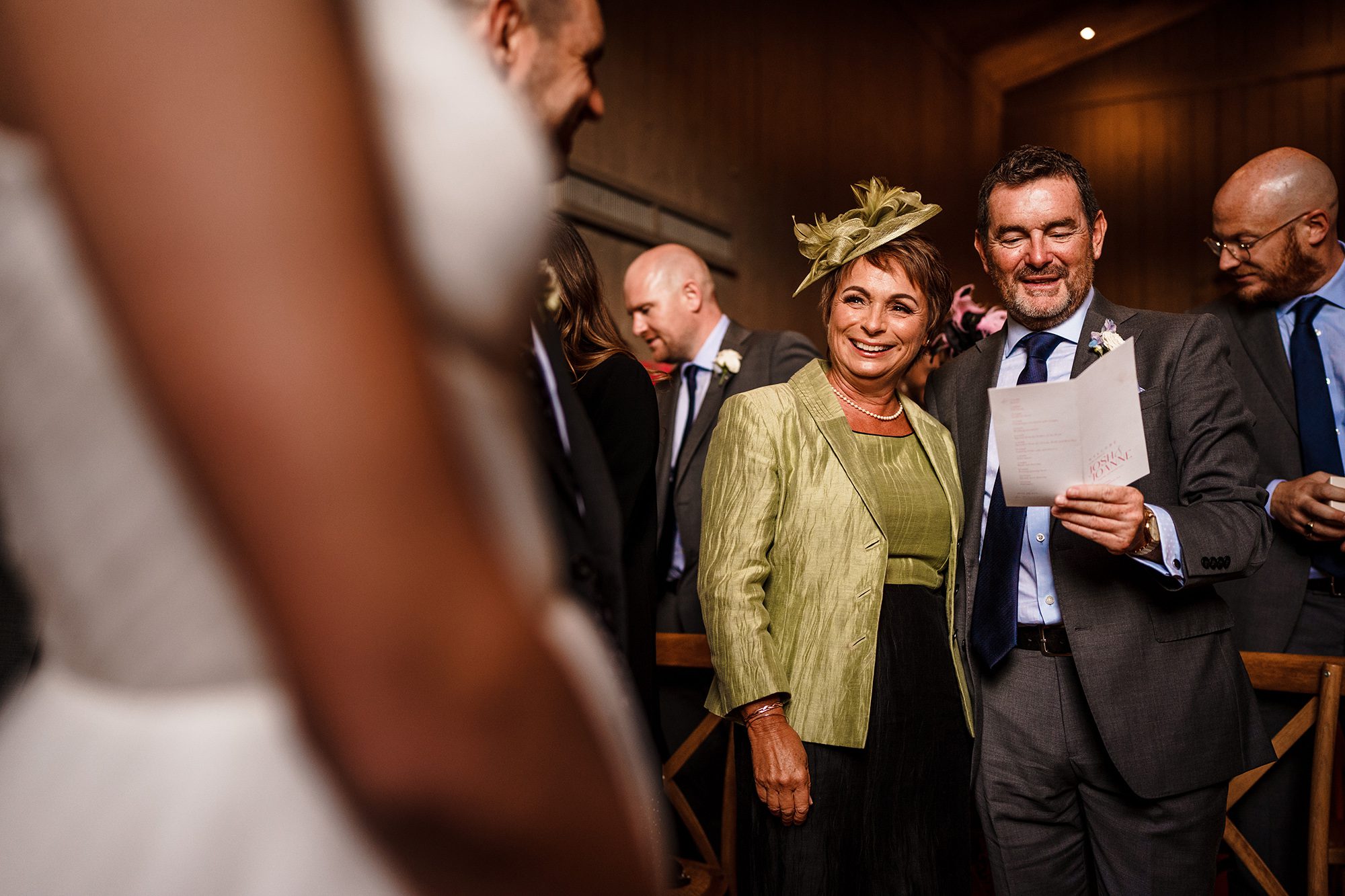 Parents of the Groom recite a passage from the wedding program during the ceremony at Primrose Hill Farm, Banbury, Oxfordshire.