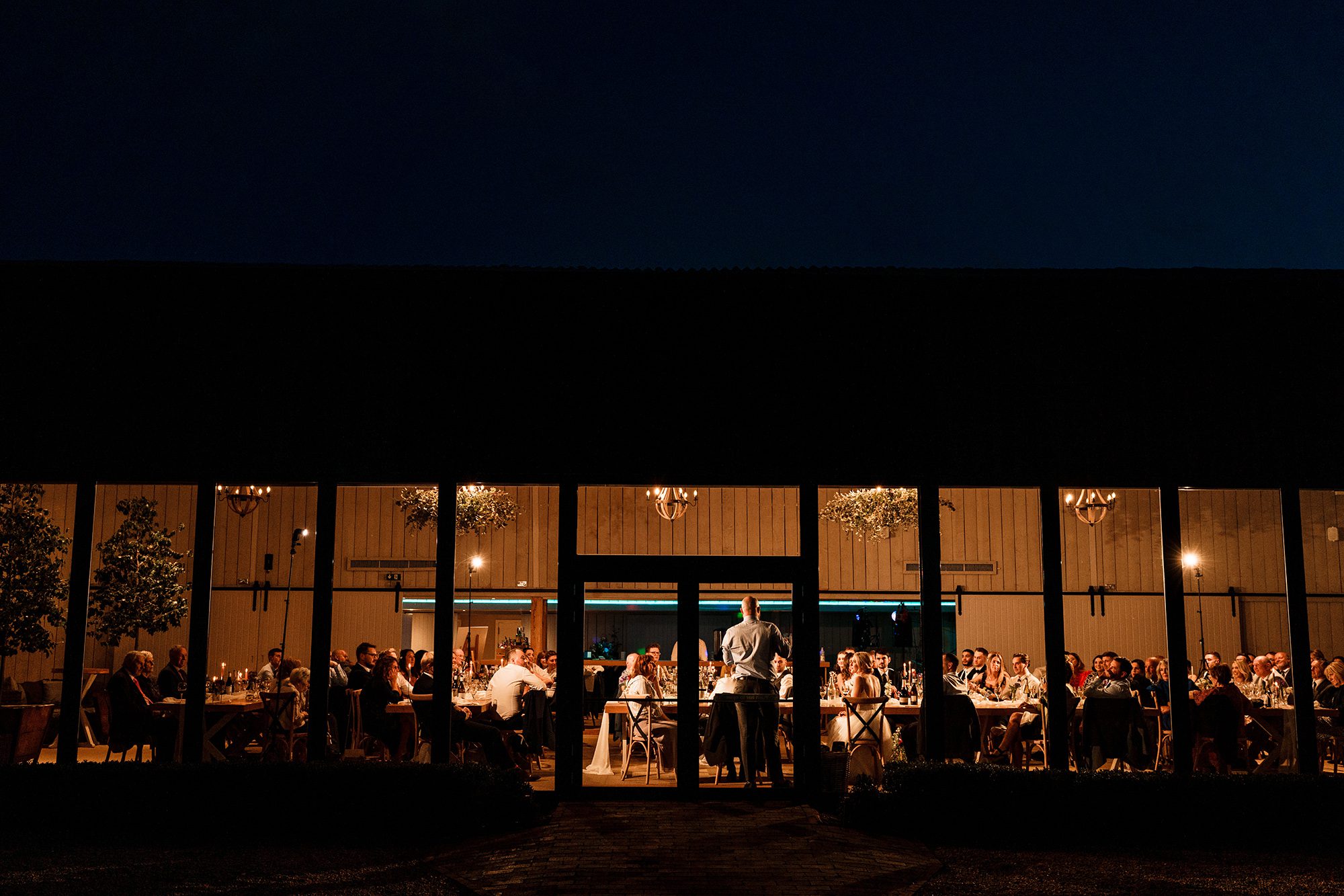 Primrose Hill Farm lit up under the Banbury twilight.