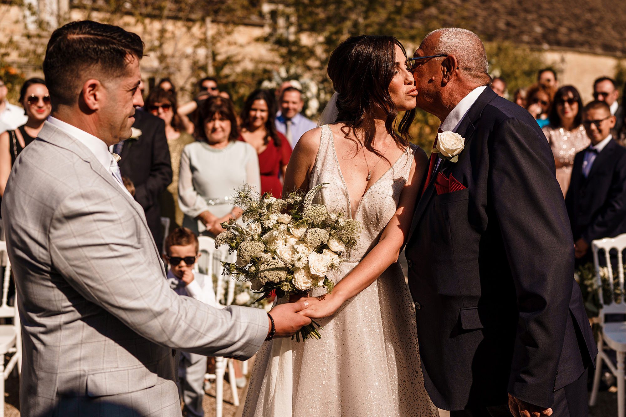 father of the bride gives away his daughter