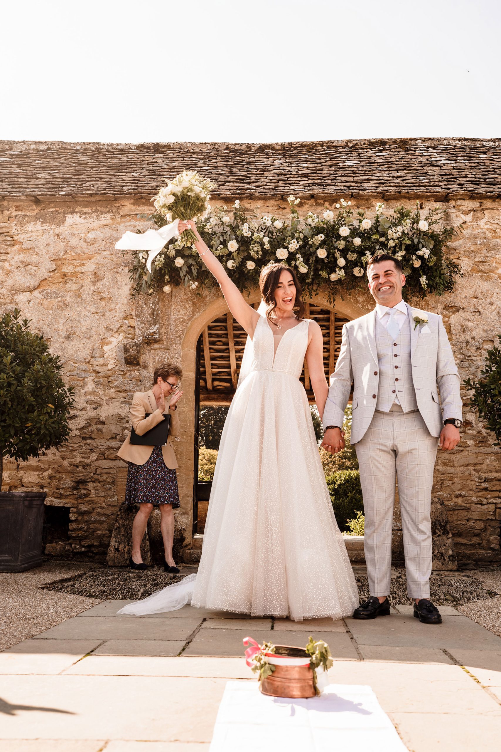 bride celebrates Caswell House wedding being over