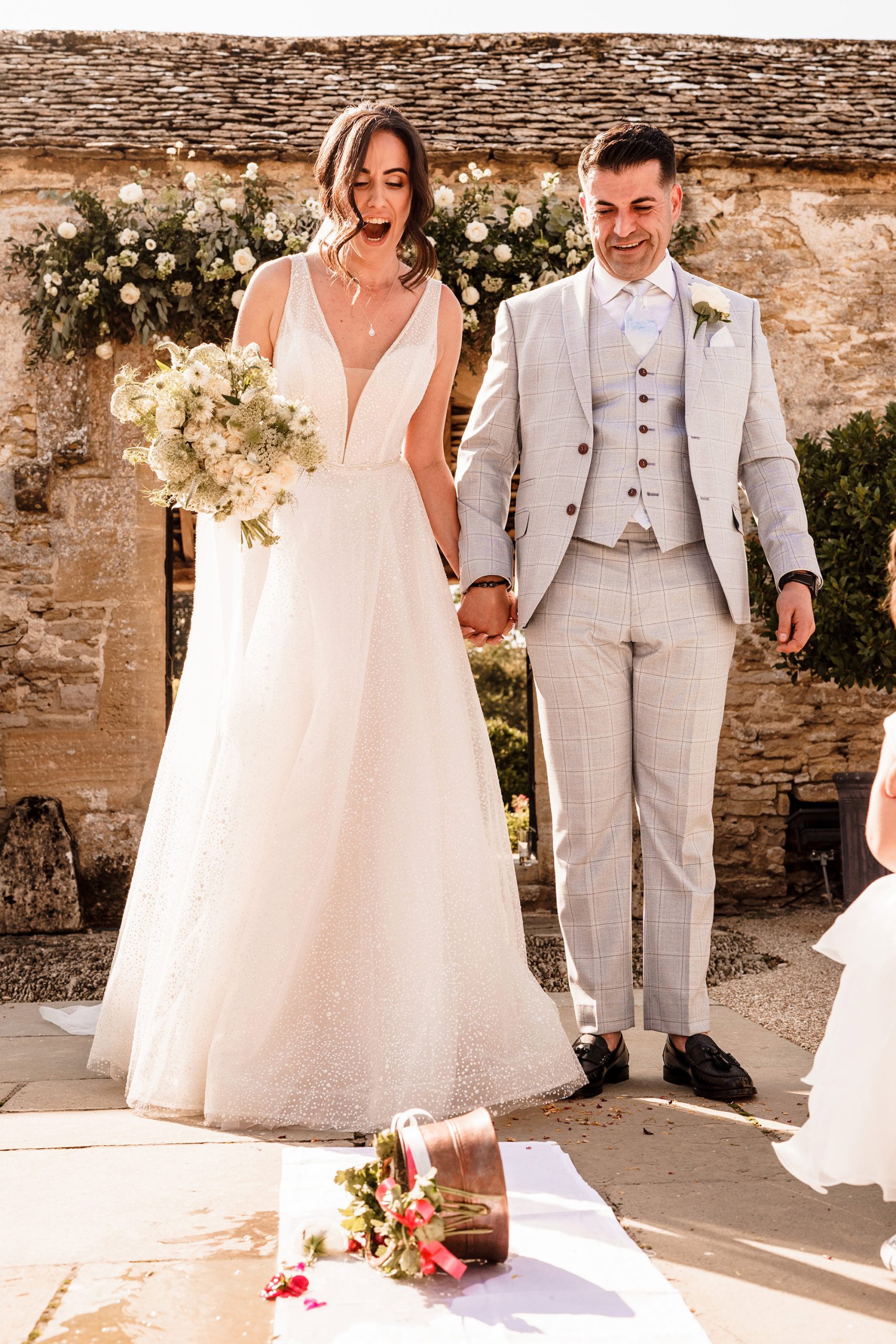 bride kicks over a bucket in wedding tradition
