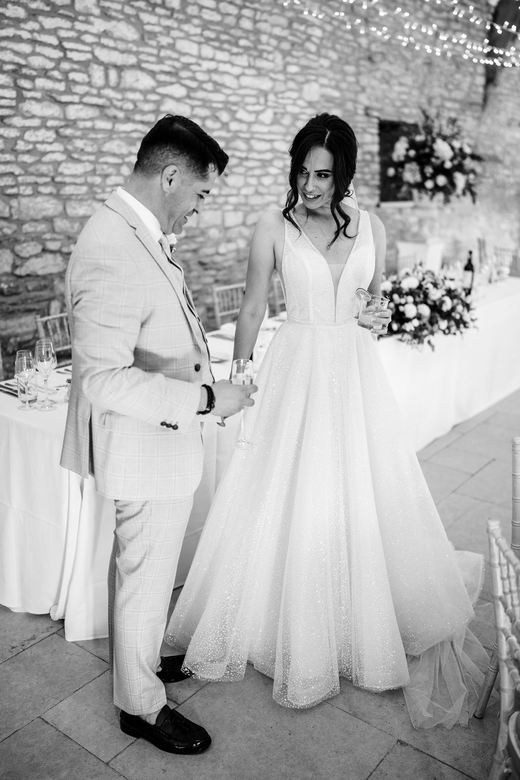 groom admires his wife in the Caswell House barn