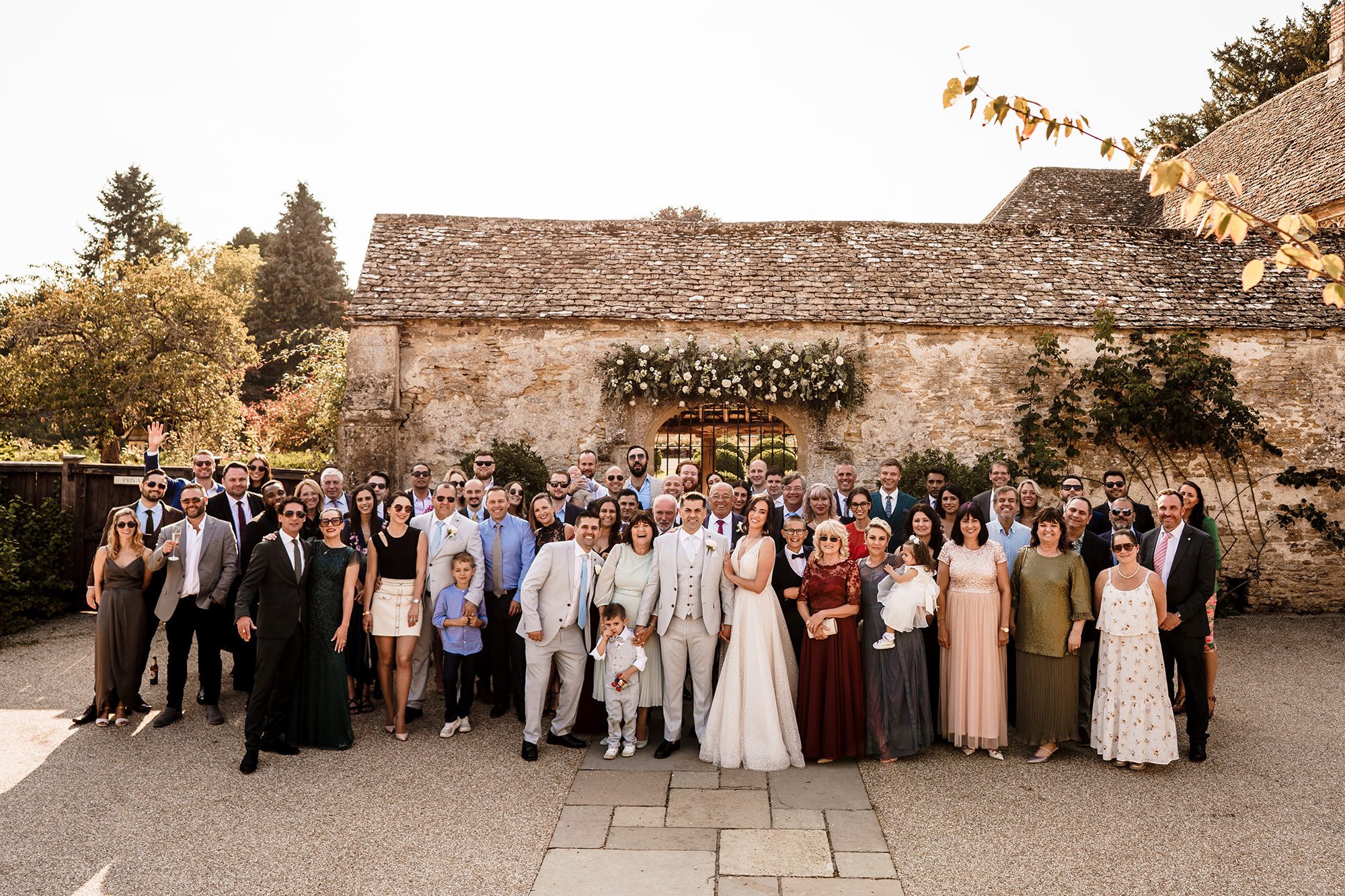 all of the wedding guests stood in Caswell House court yard