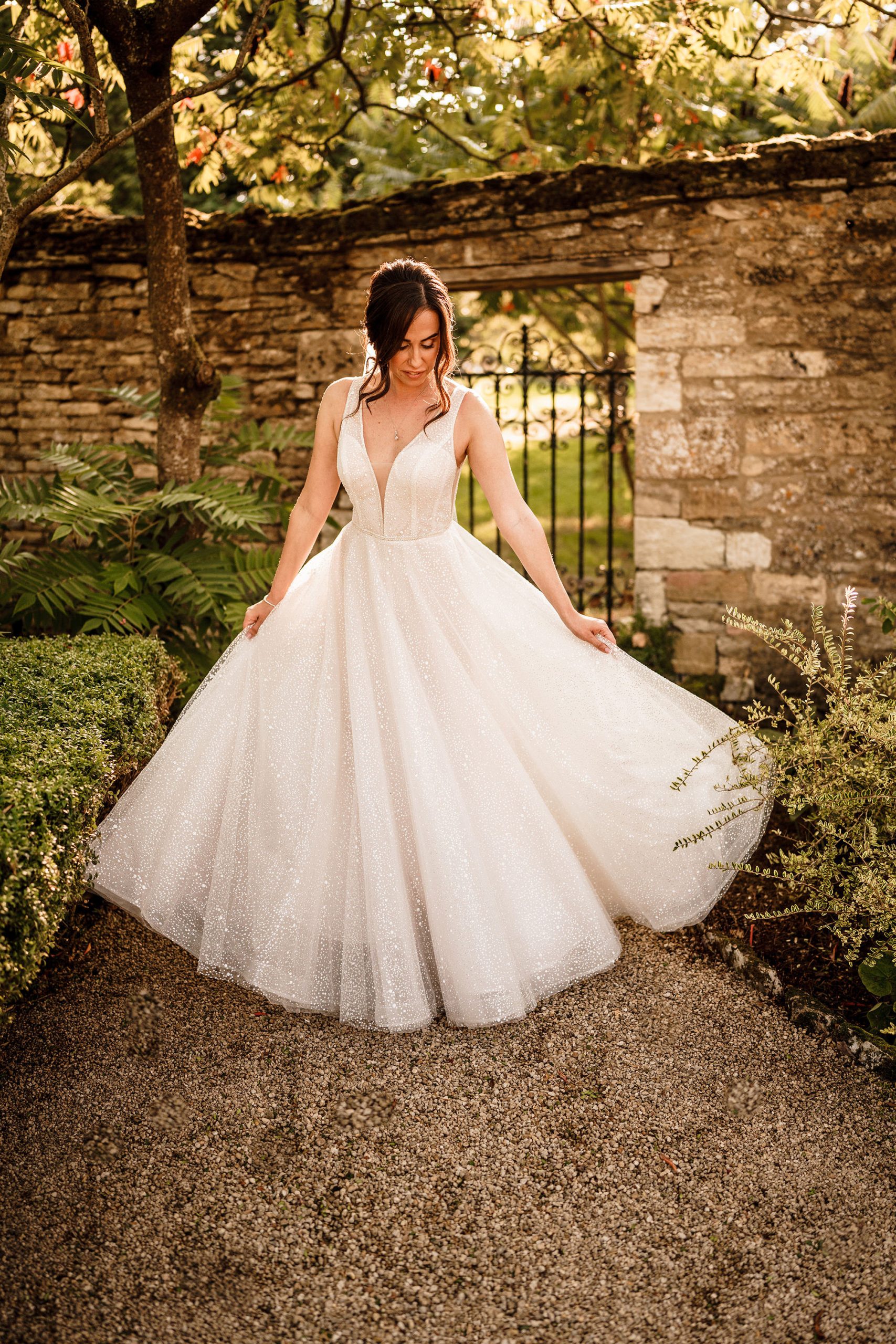 bride showing off her dress at Caswell House