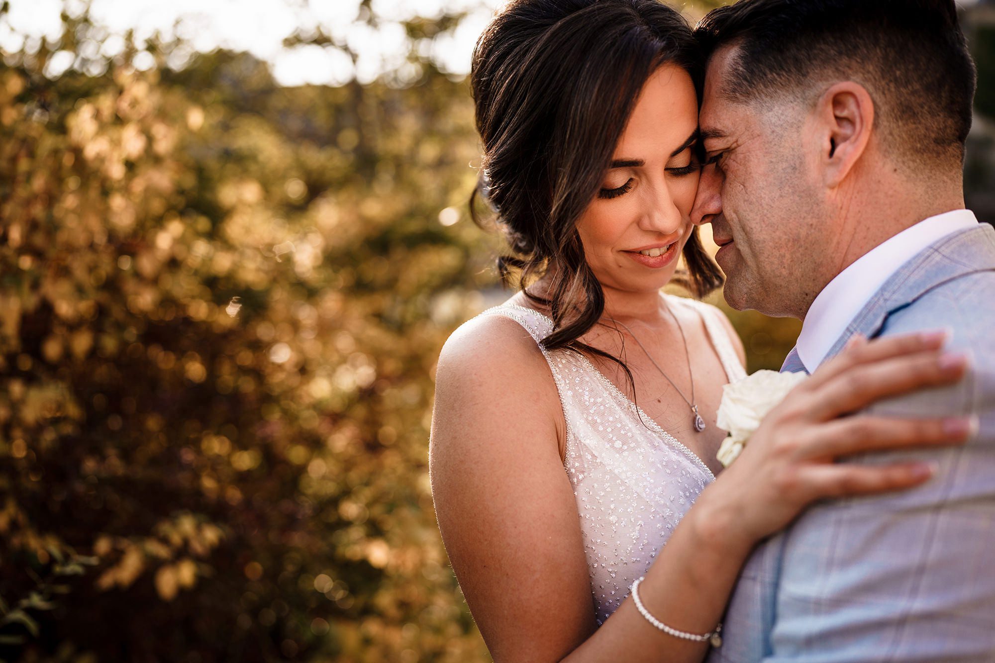 close up as couple pose for a photo
