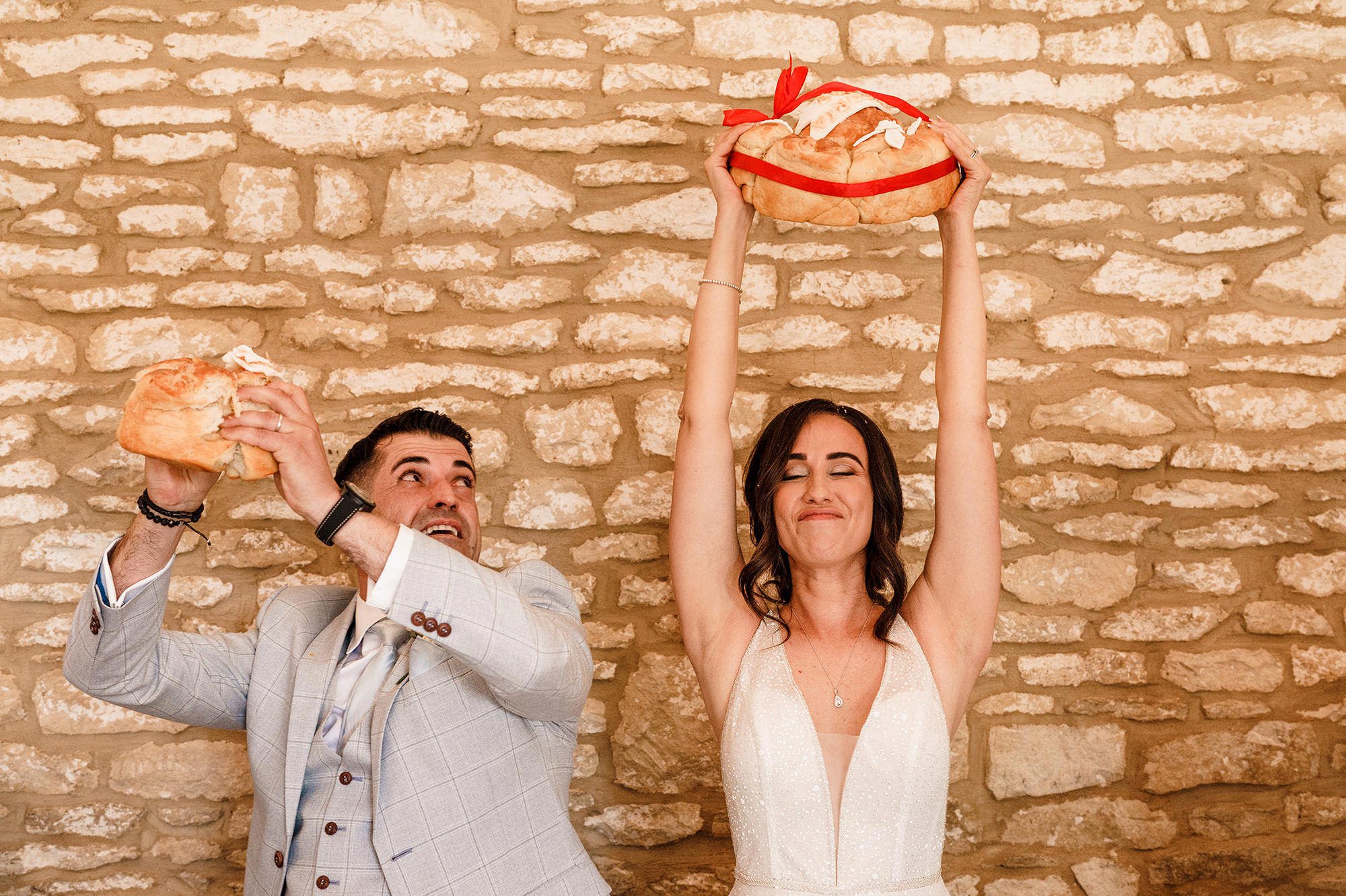 bride holds bead above head for tradition