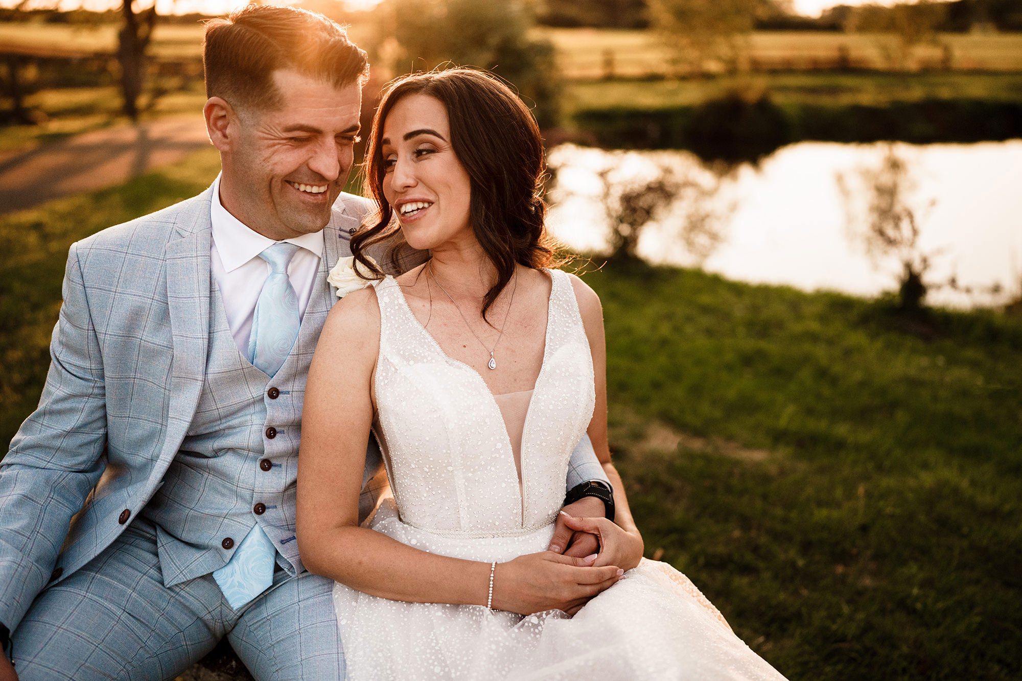 groom in a suit with his bride in her dress at Caswell House
