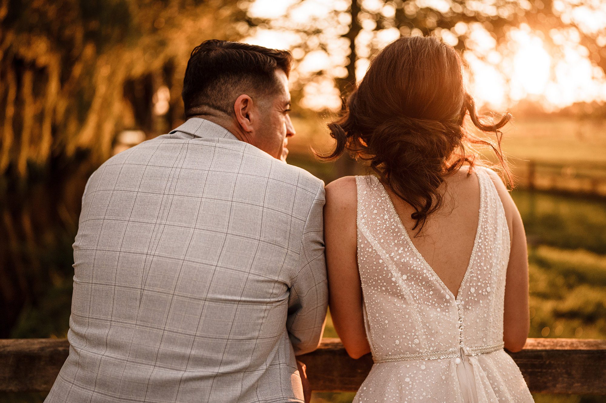 groom and bride face away from photographer for photo