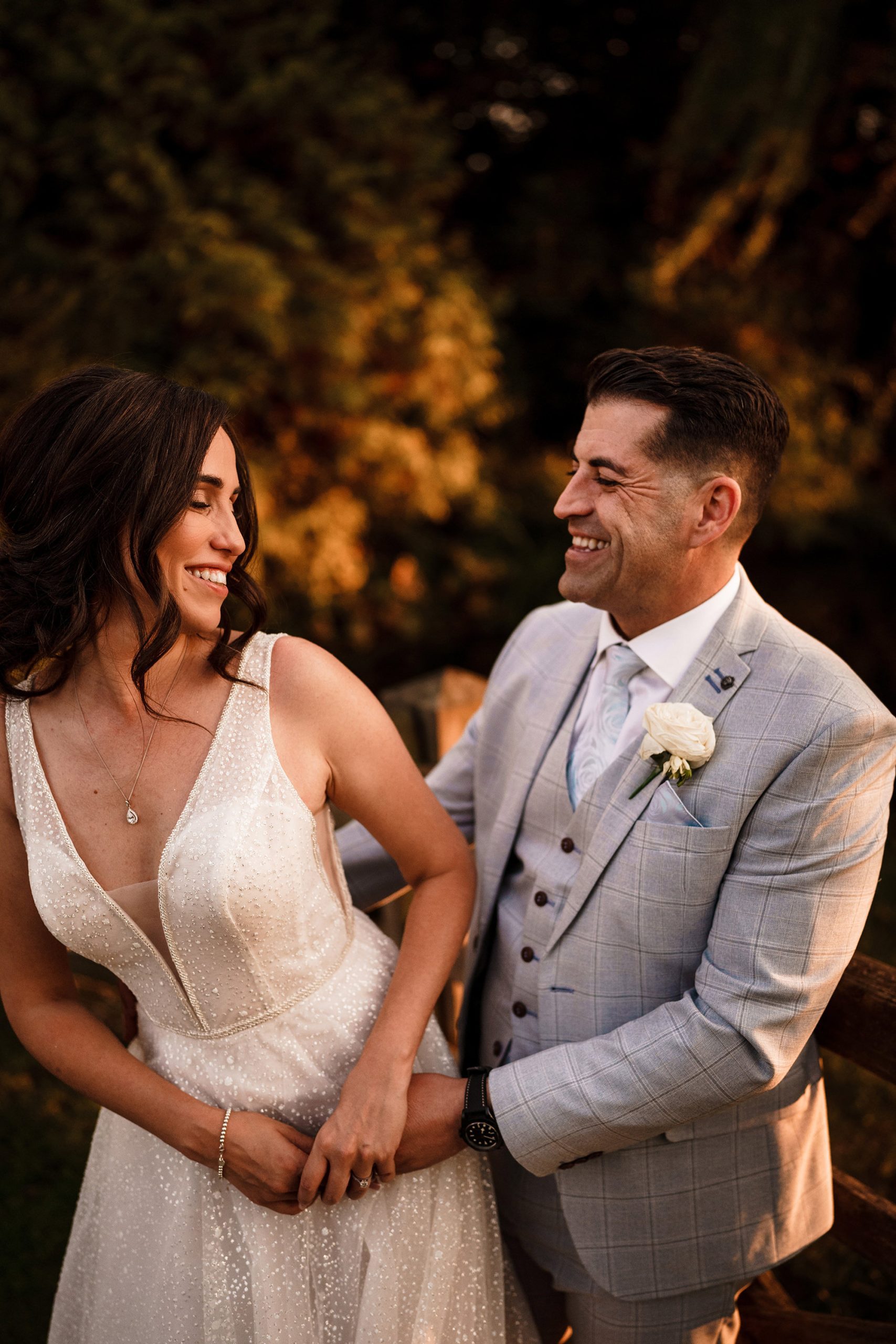 bride and groom laughing during photoshoot at caswell house