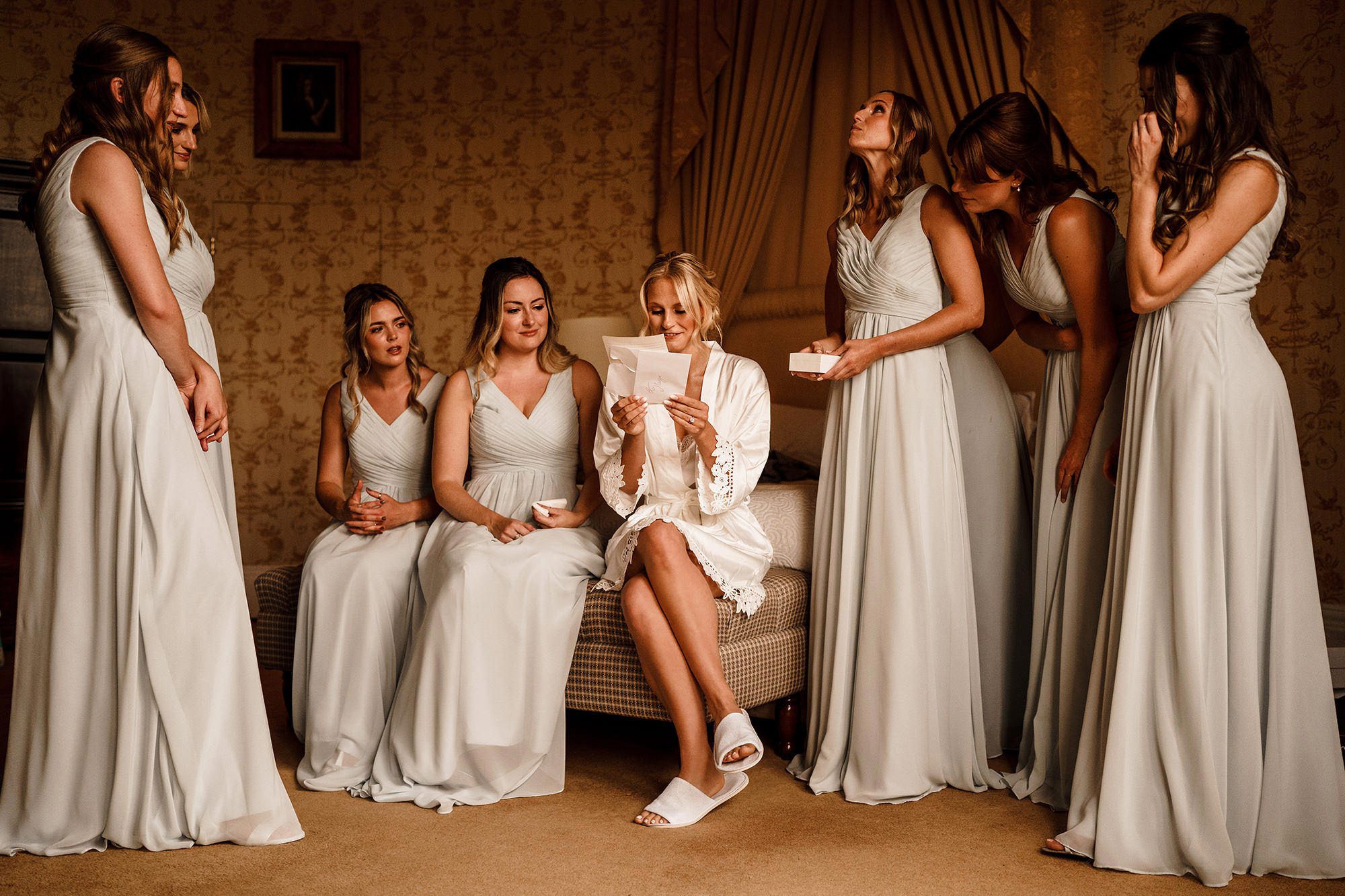 bride surrounded by bridesmaids in Stanley London wedding venue