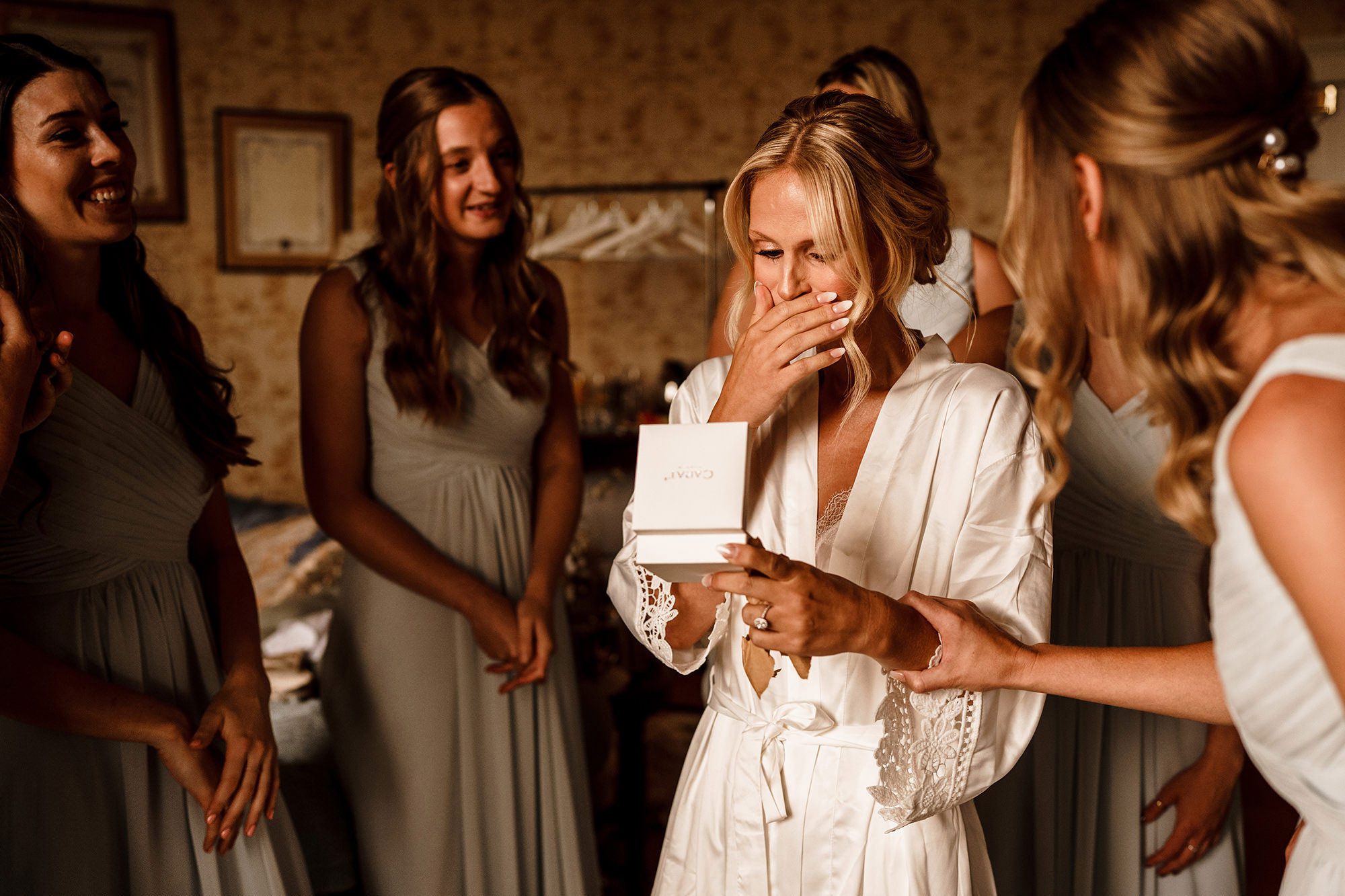 brides in shock looking at gift