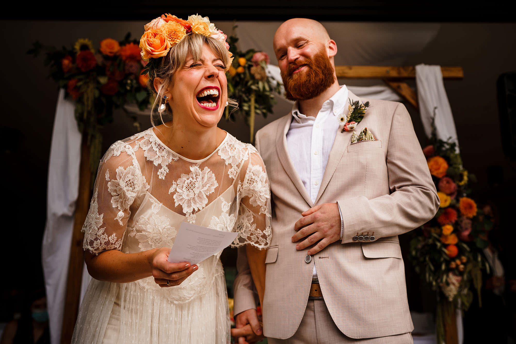 bride laughing during wedding ceremony