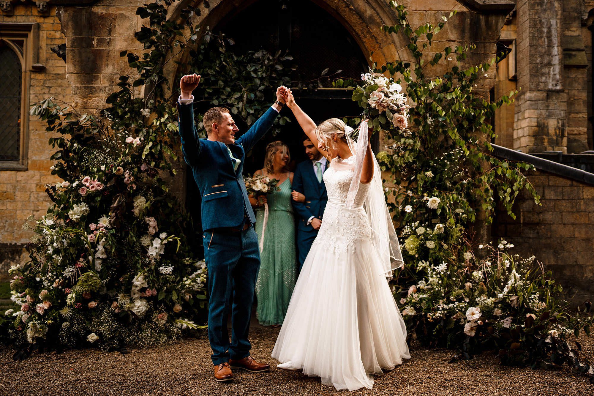 Bride and groom celebrate outside church wedding ceremony