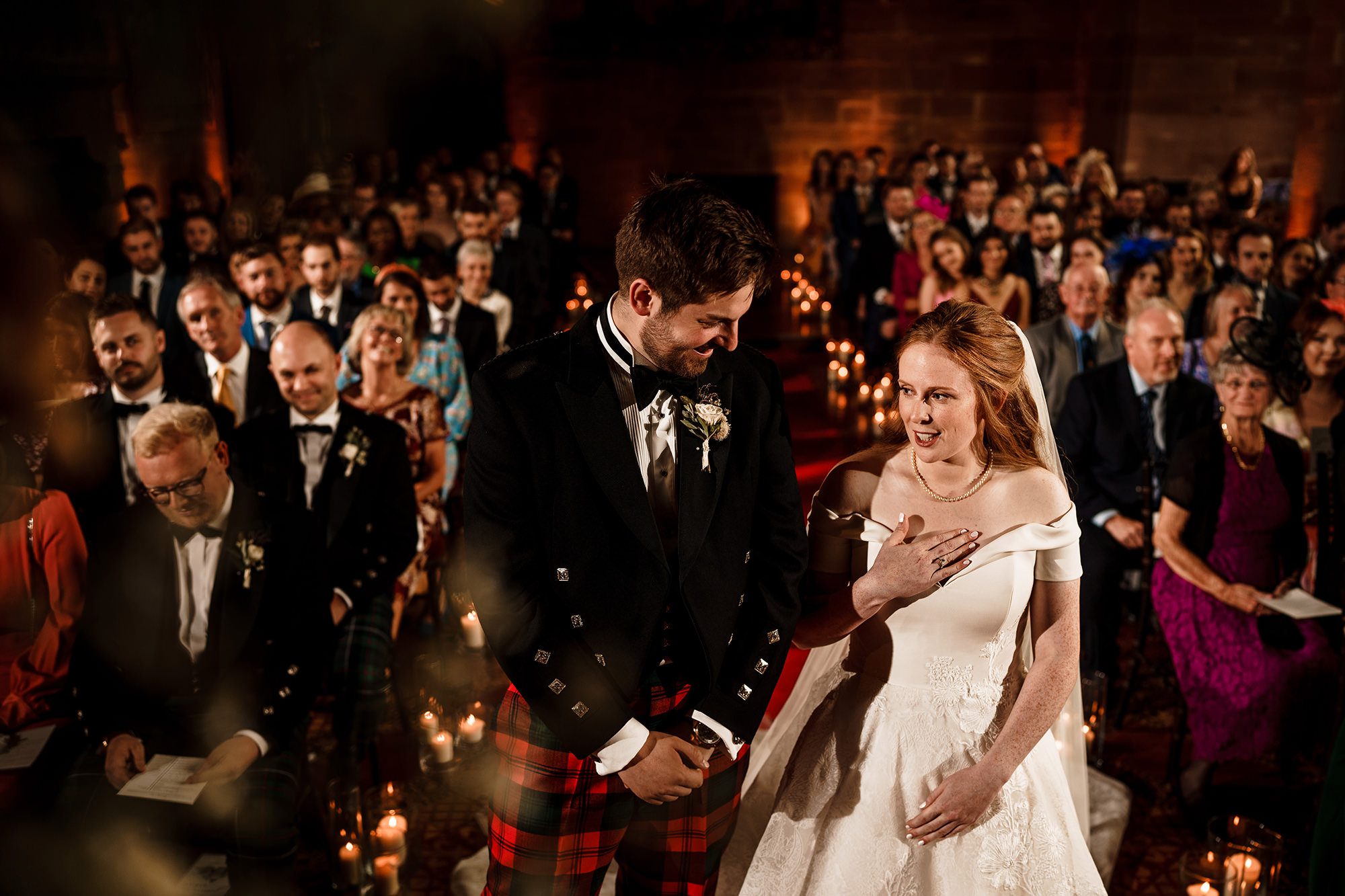 bride and groom at the end of the aisle saying their vows to each other