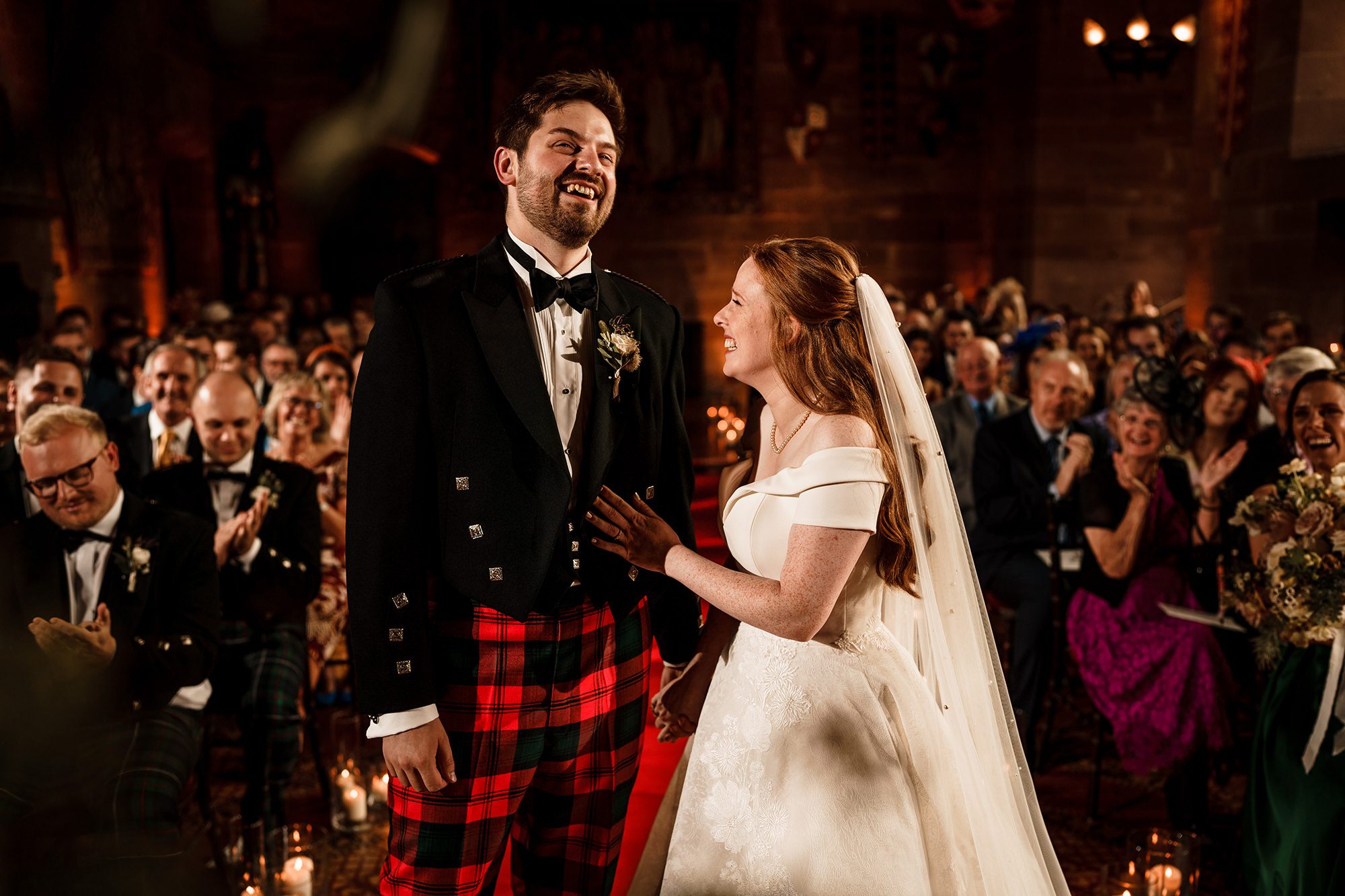 bride and groom at wedding ceremony at Peckforton Castle