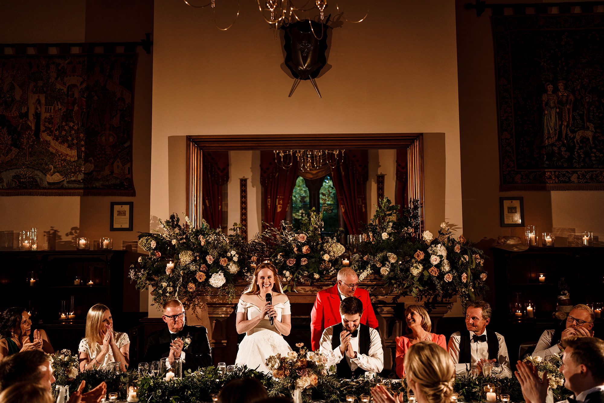 bride giving introductory speech at her own wedding at Peckforton castle