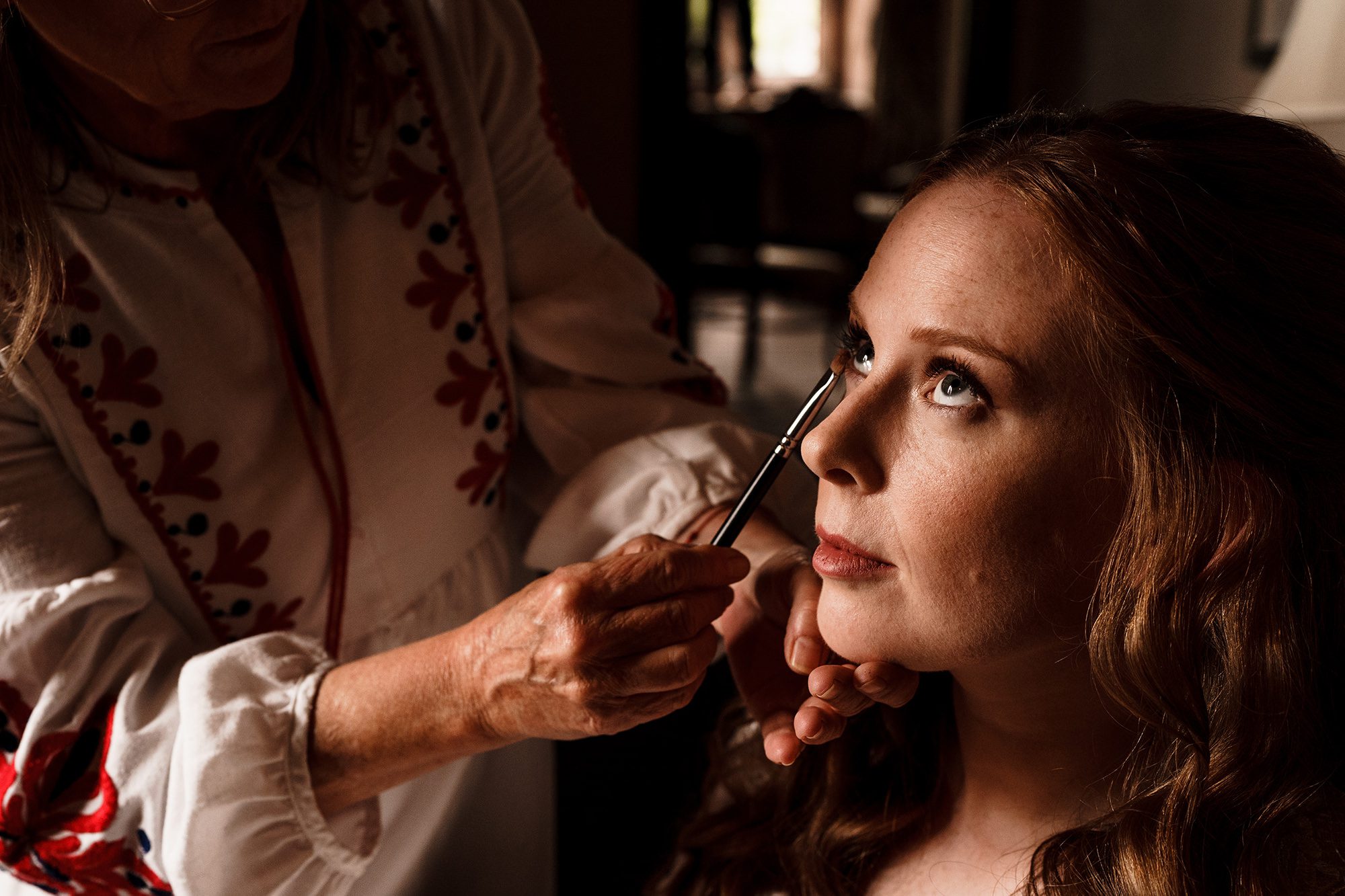 make up being applied to bride at Peckforton castle