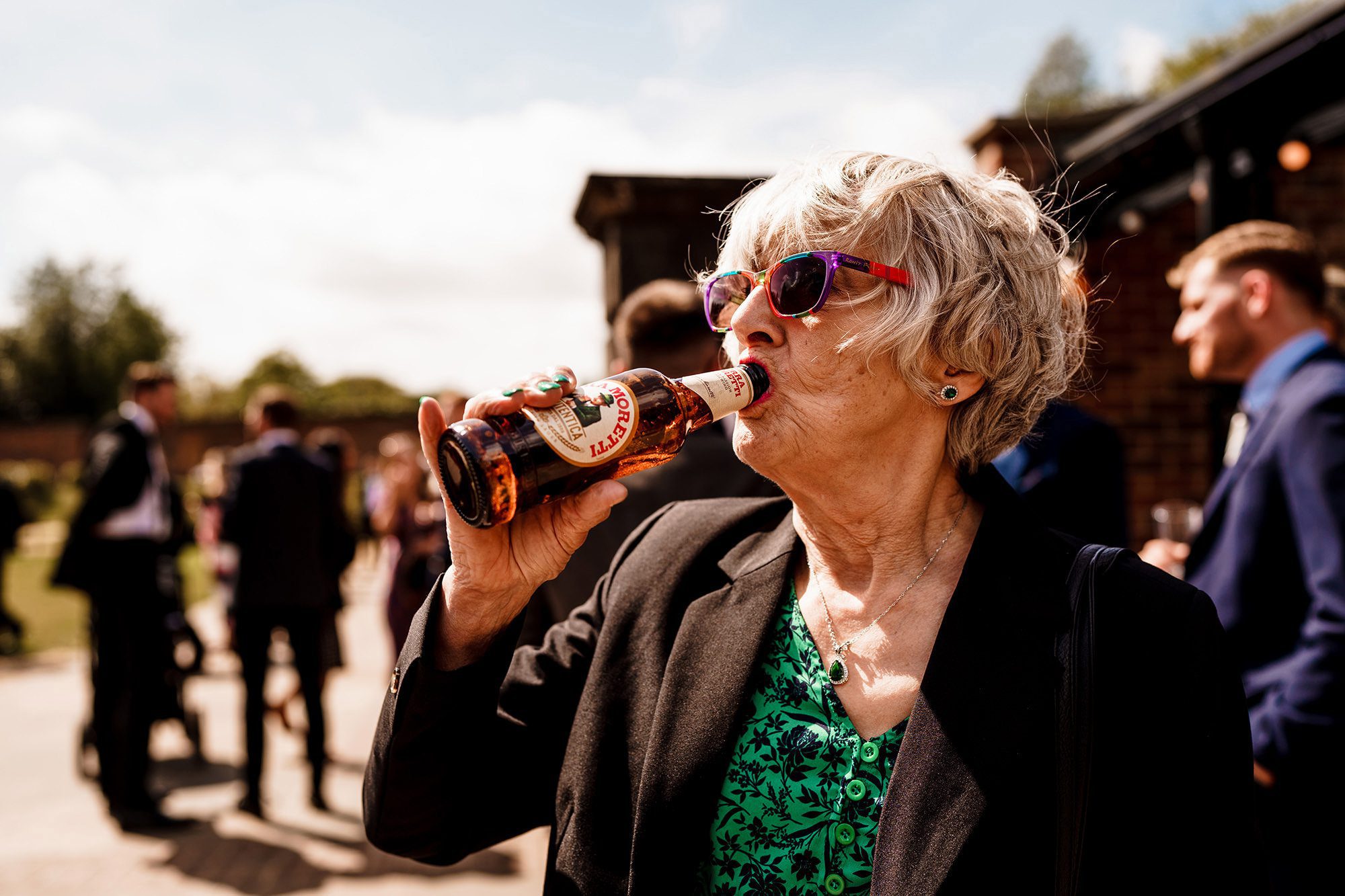 candid moment of guest drinking beer