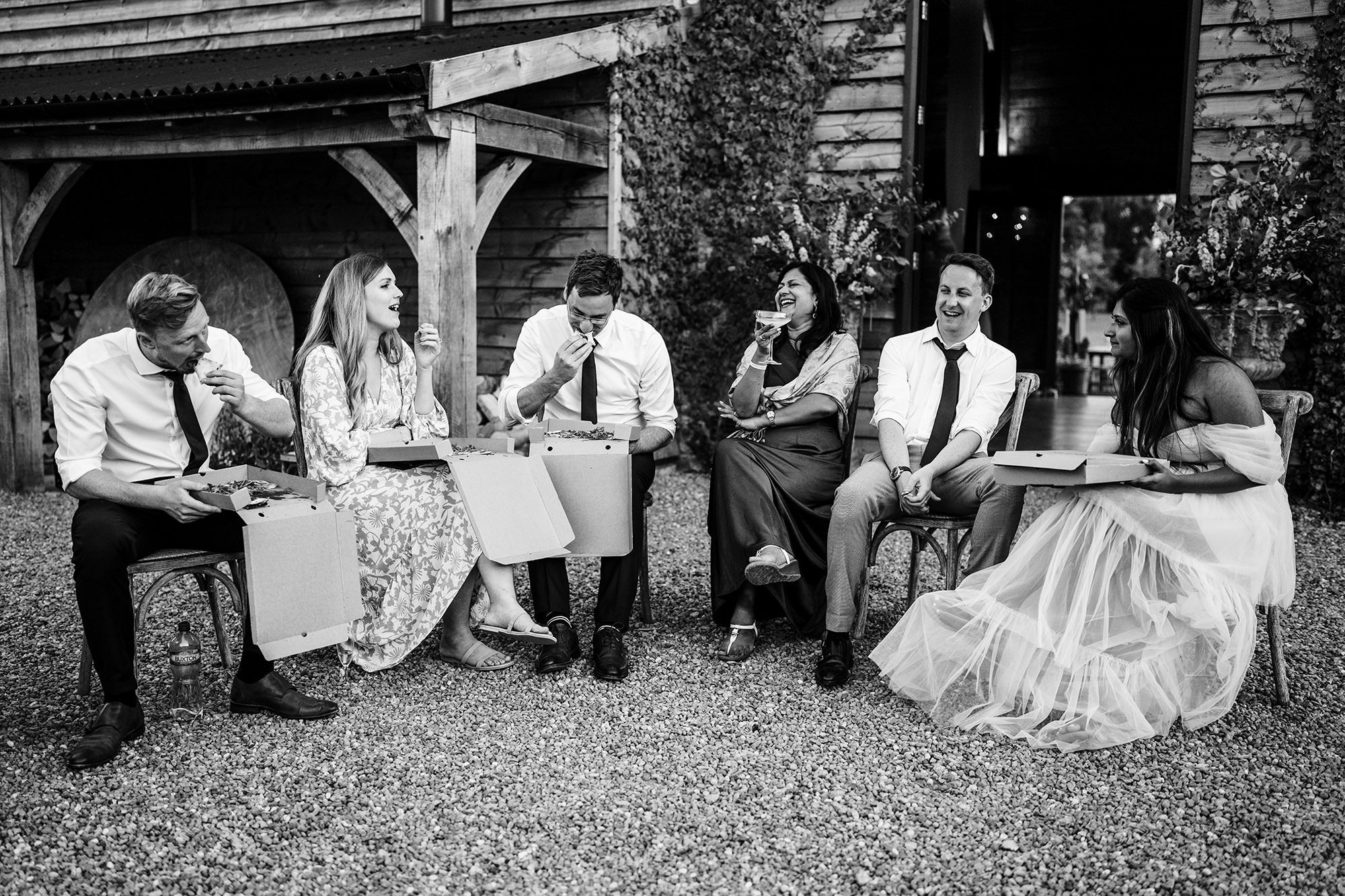 wedding guests candidly enjoying food at wedding