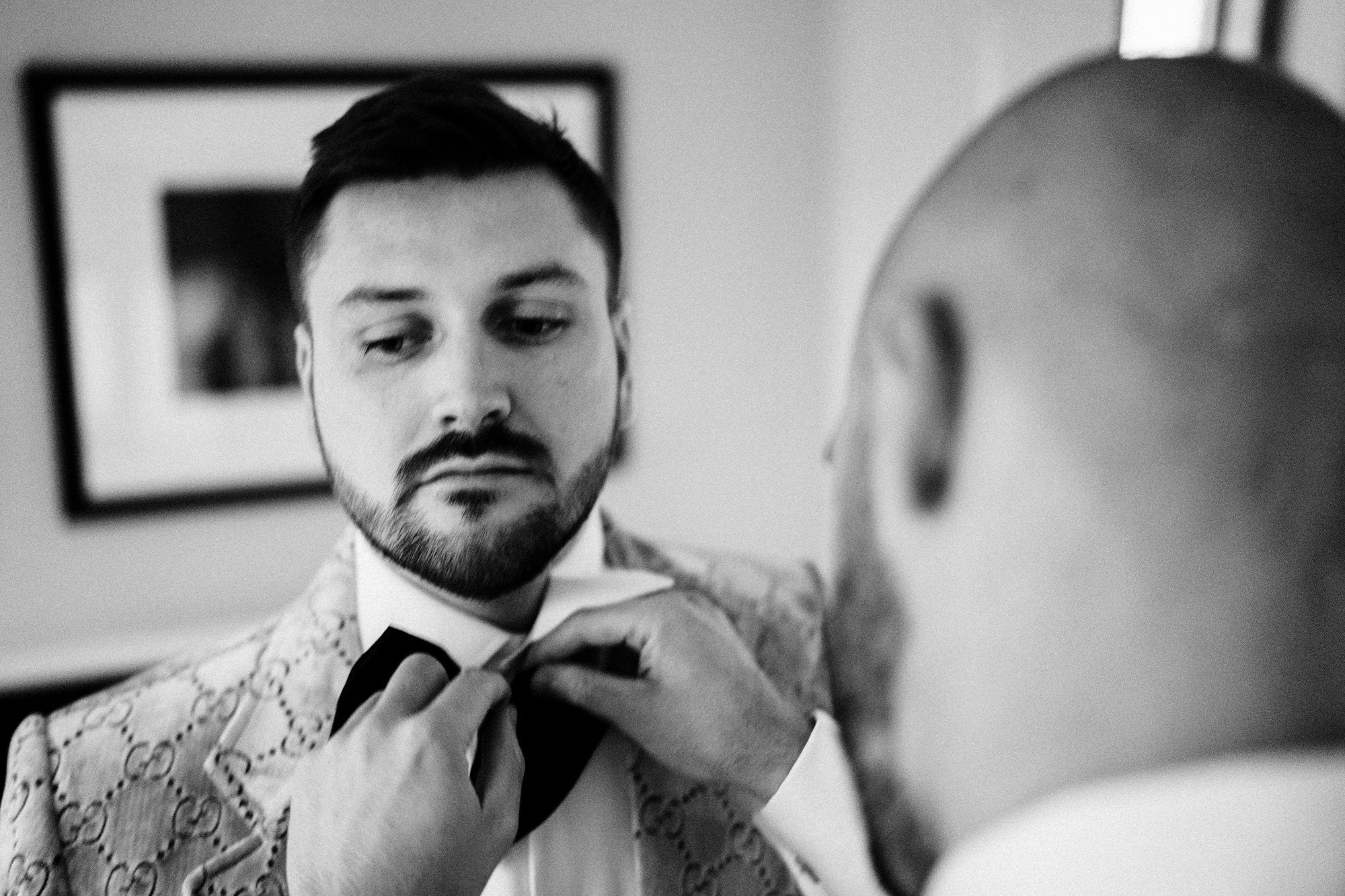 granary estates wedding photography of groom getting dressed