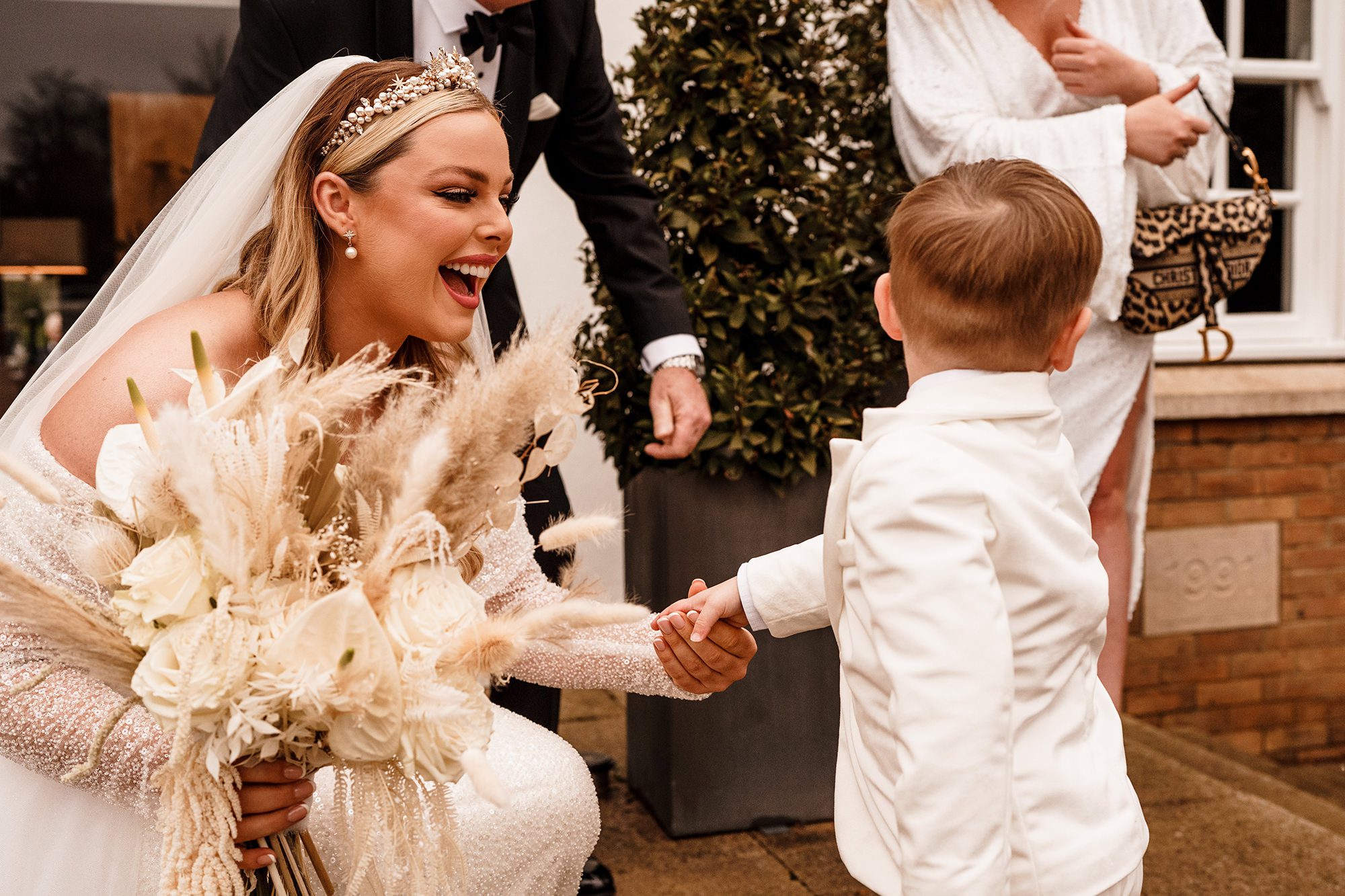 bride smiling at her son before her suffolk wedding