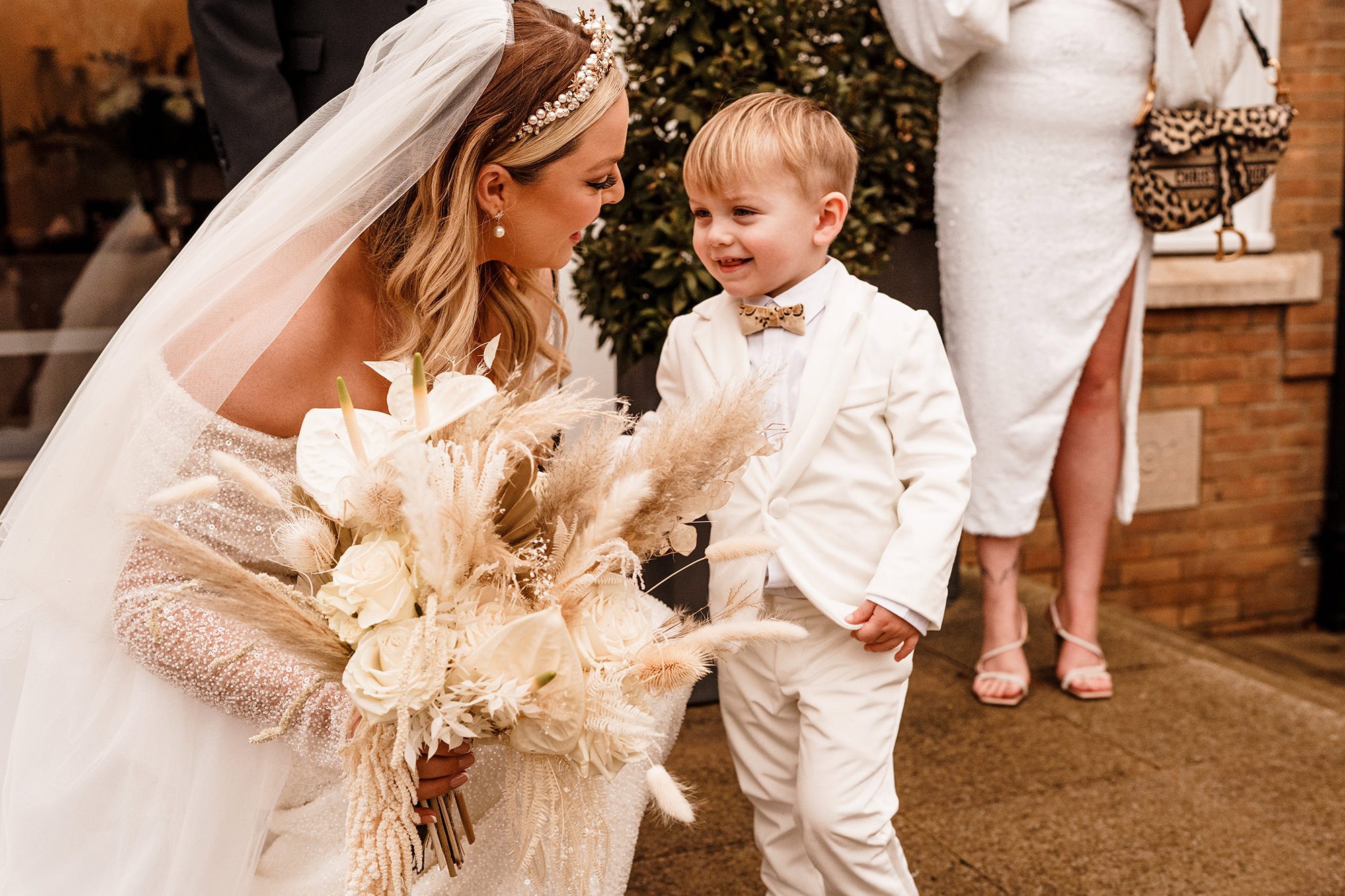 bride with her son all dressed up for wedding