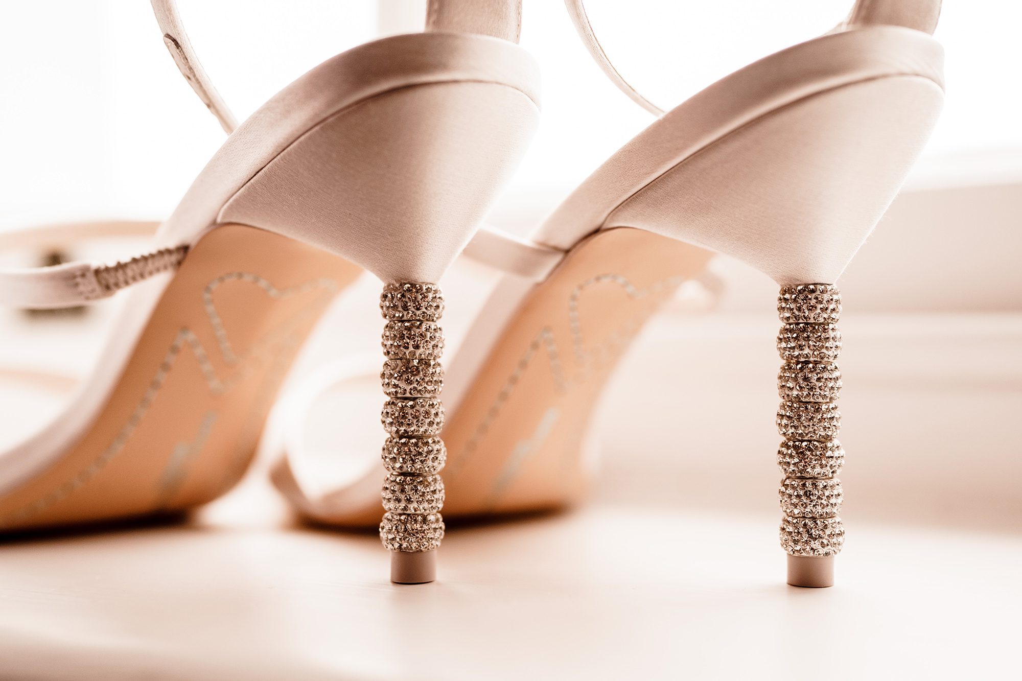 wedding shoes next to window