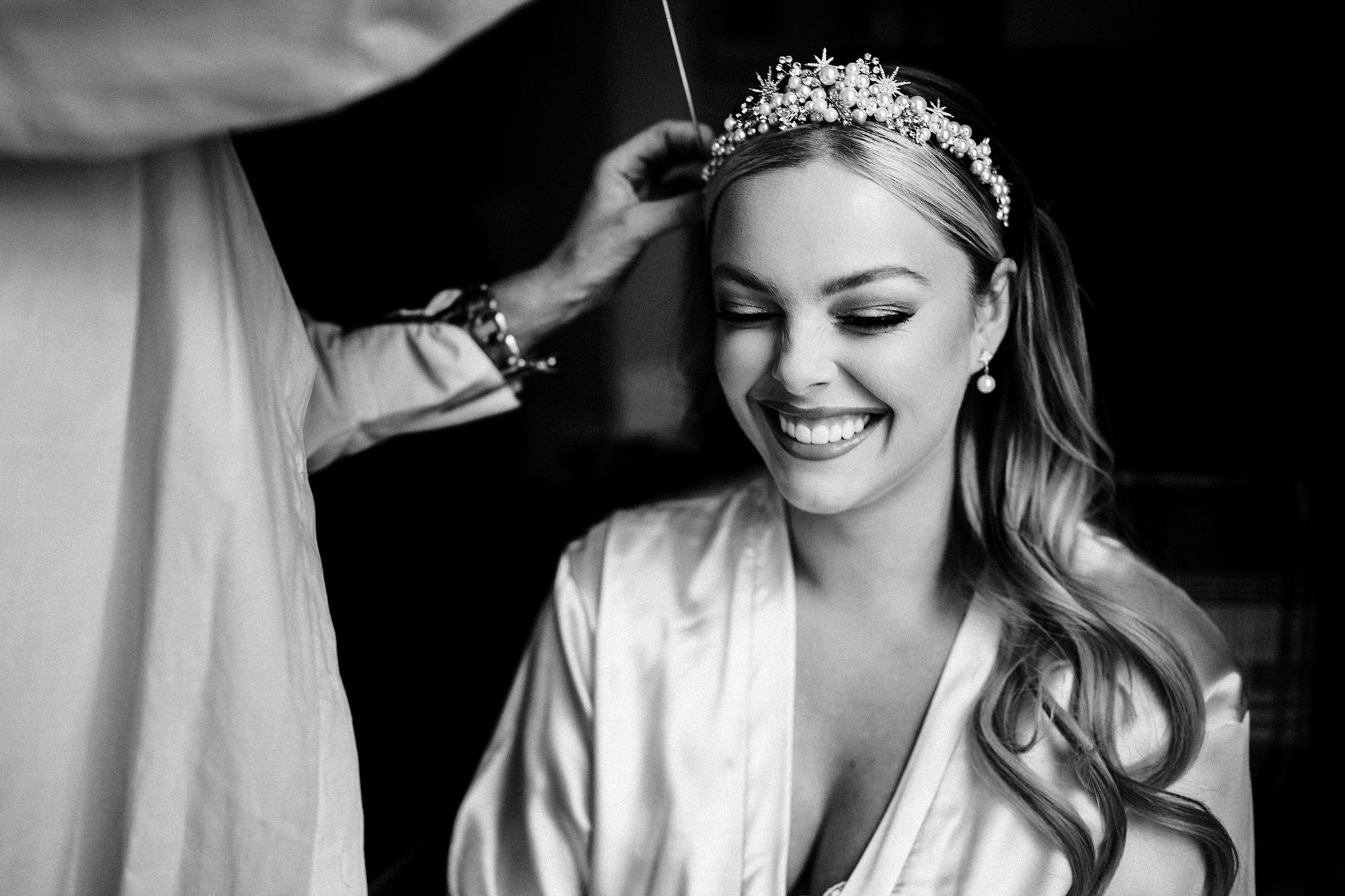 mother of the bride getting the bride ready in suffolk