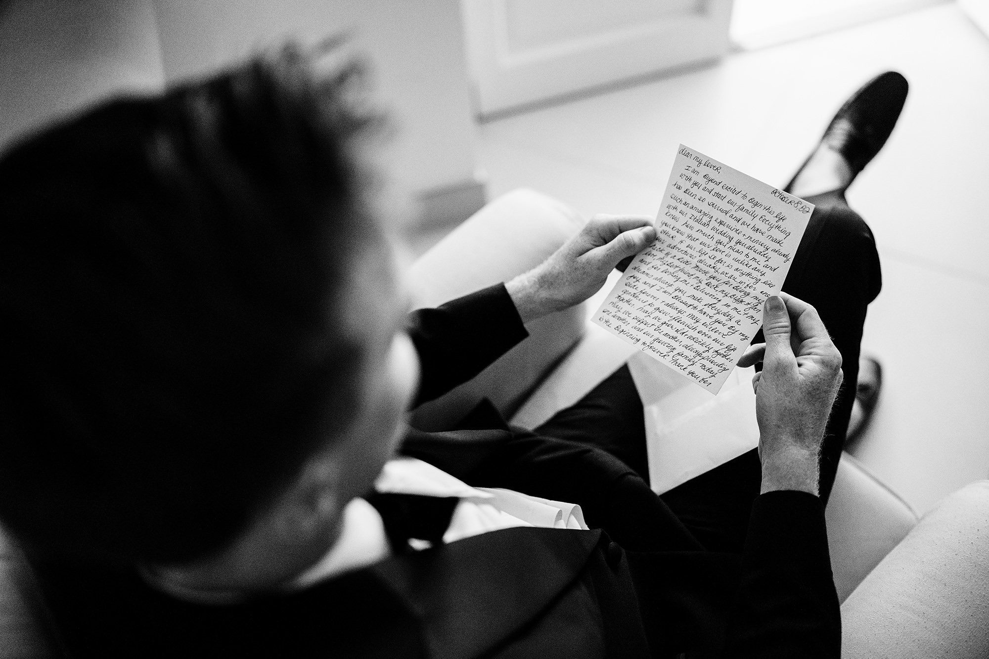 groom reads a letter from his bride