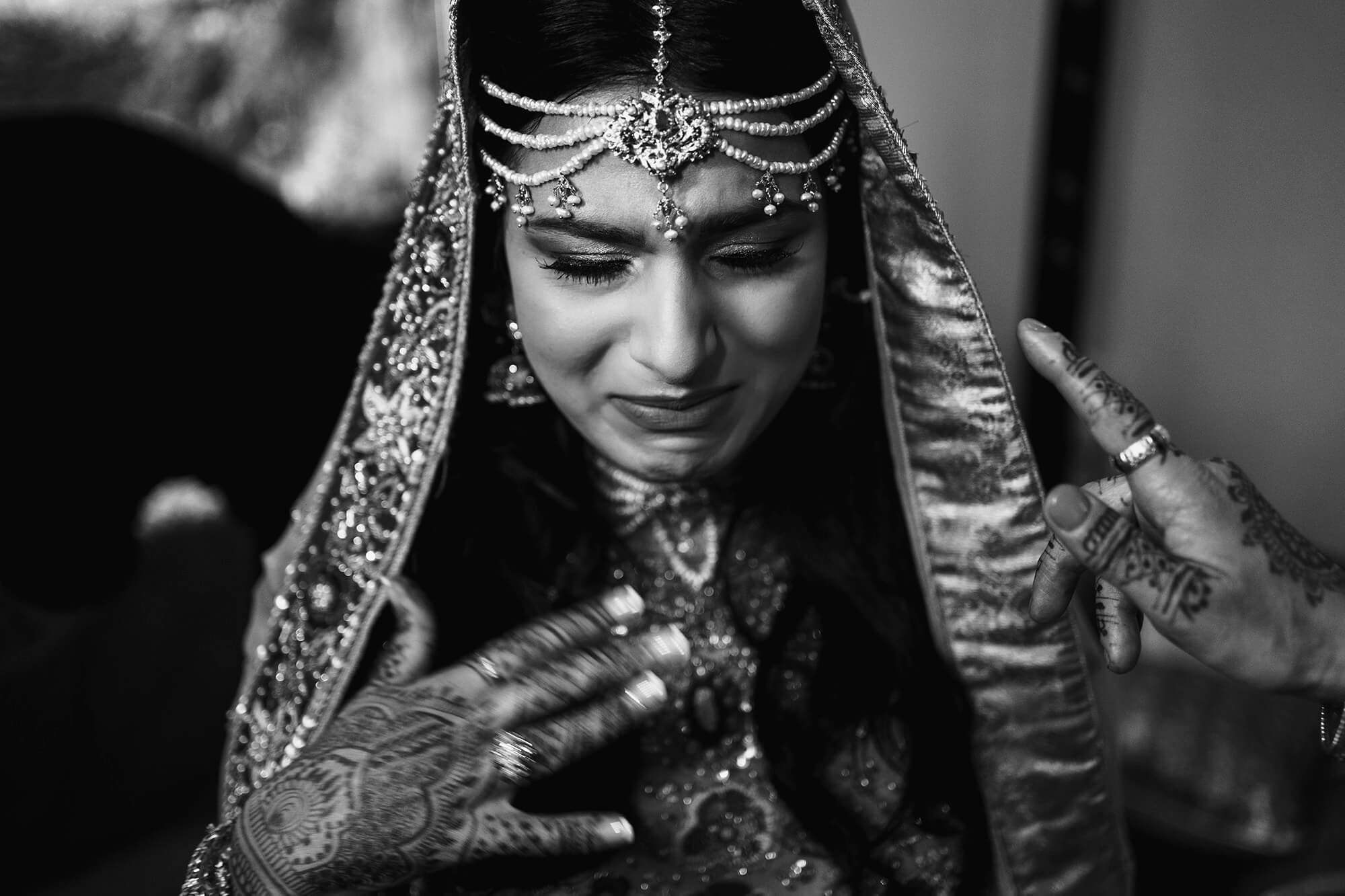 bride getting emotional before her asian wedding