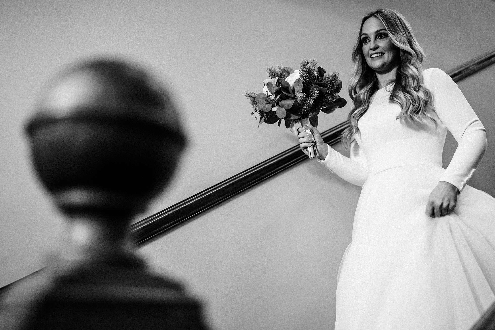 bride walking down the stairs in the west tower