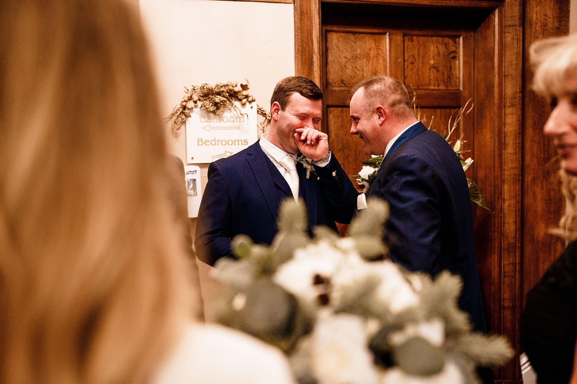 groom laughing at this West Tower Winter Wedding