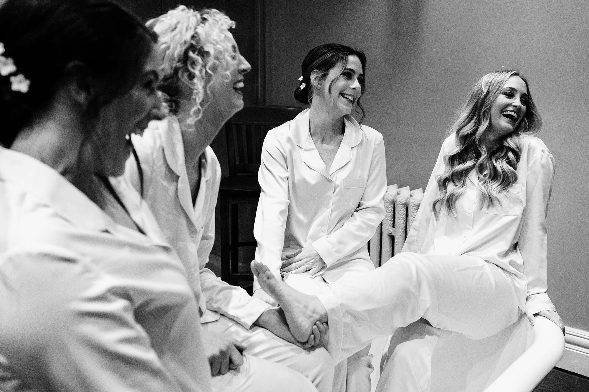 bride with er bridesmaids having fun before winter wedding