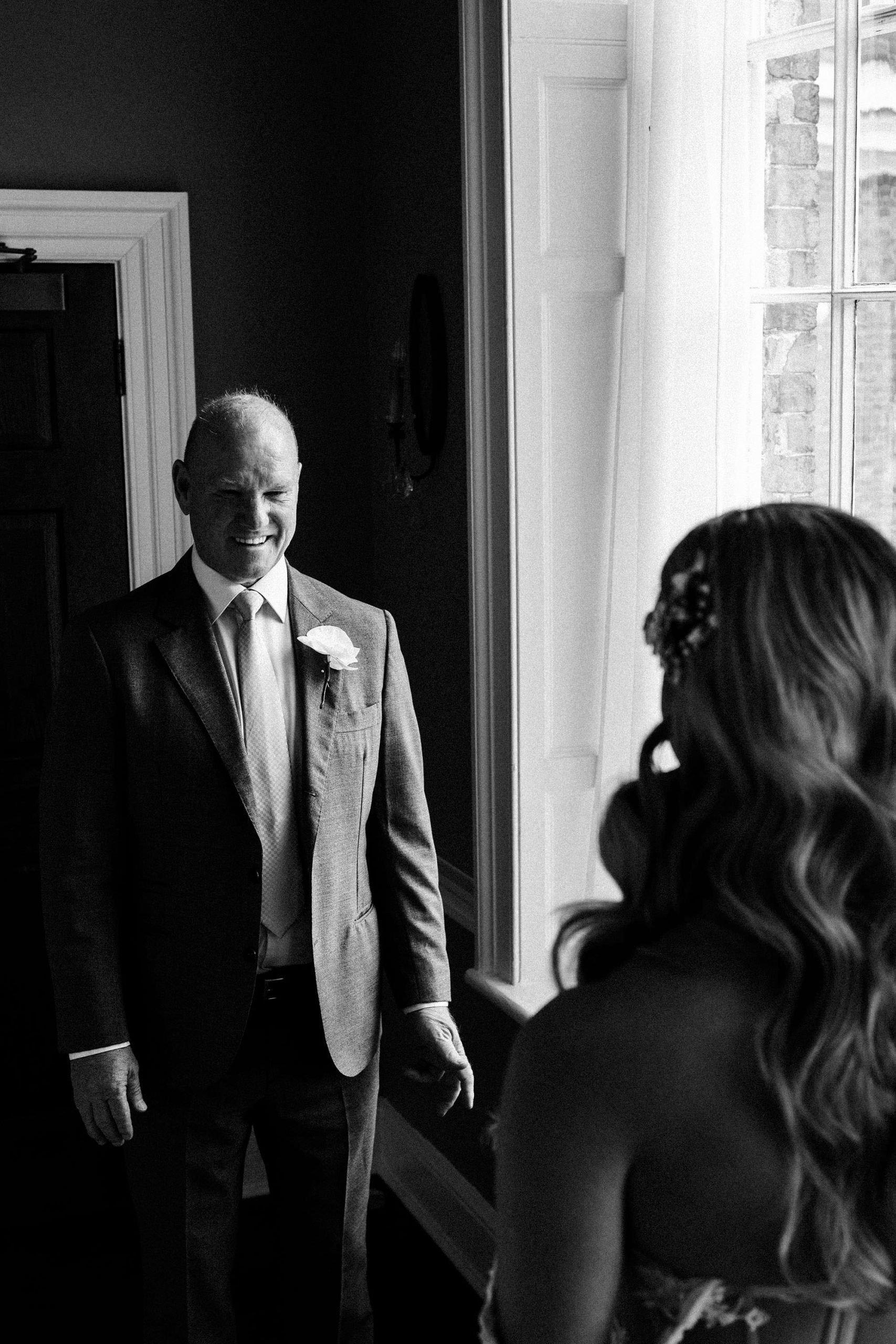 fatehr of the bride seeing his daughter in her wedding dress at Hawkstone Hall luxury wedding