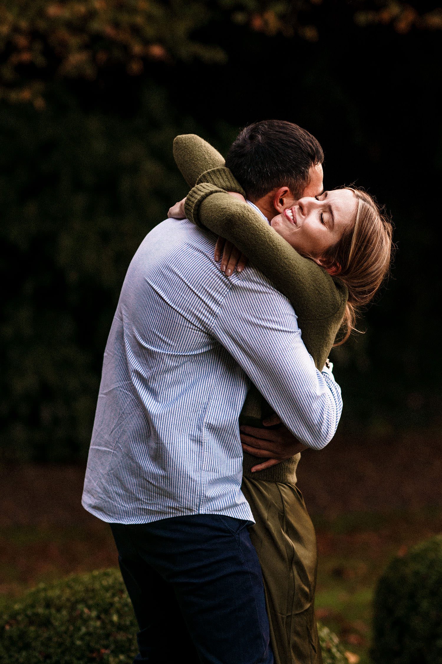 fiance hug each other in the cotswolds