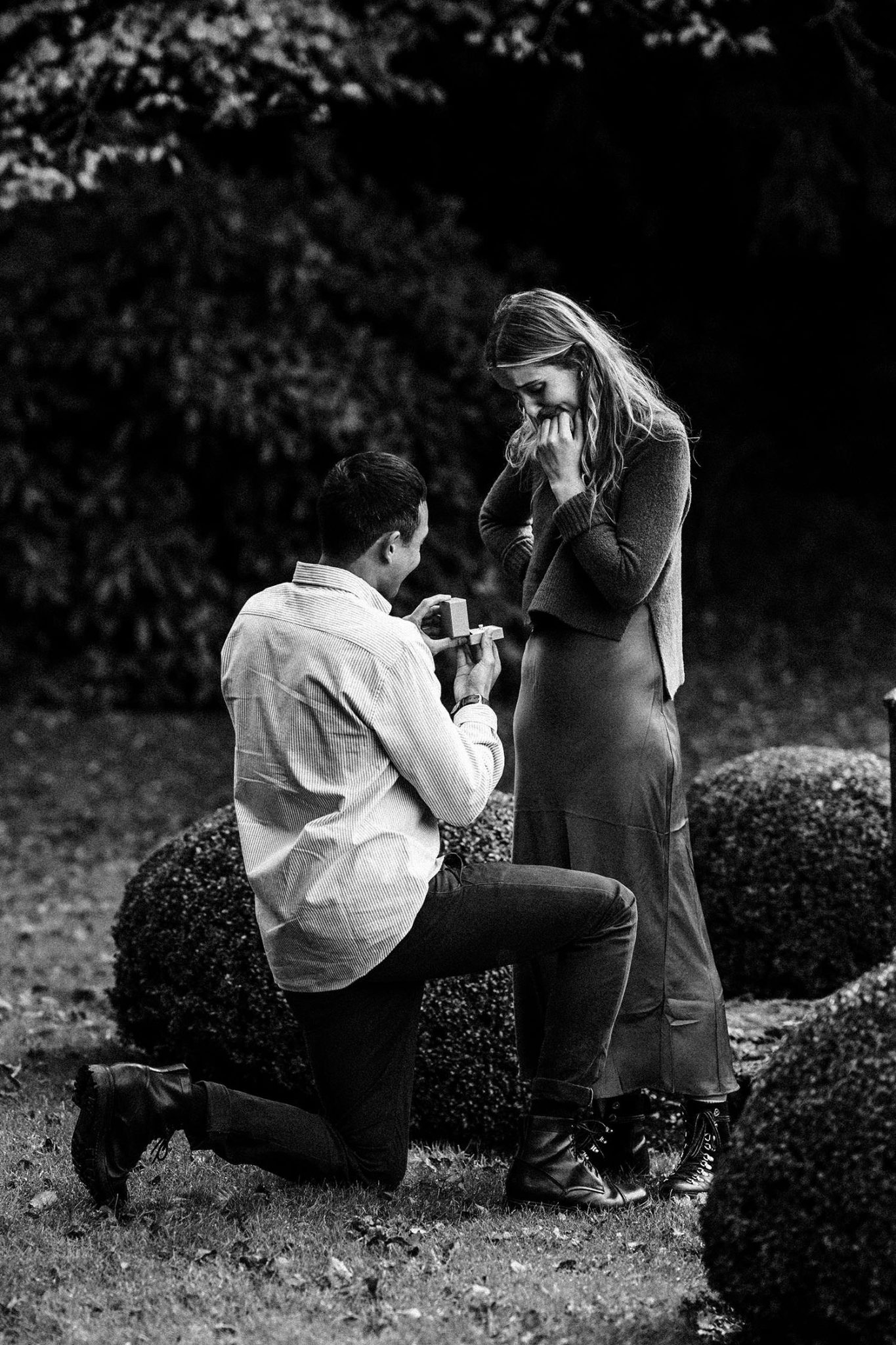 holding out ring to propose in the cotswolds