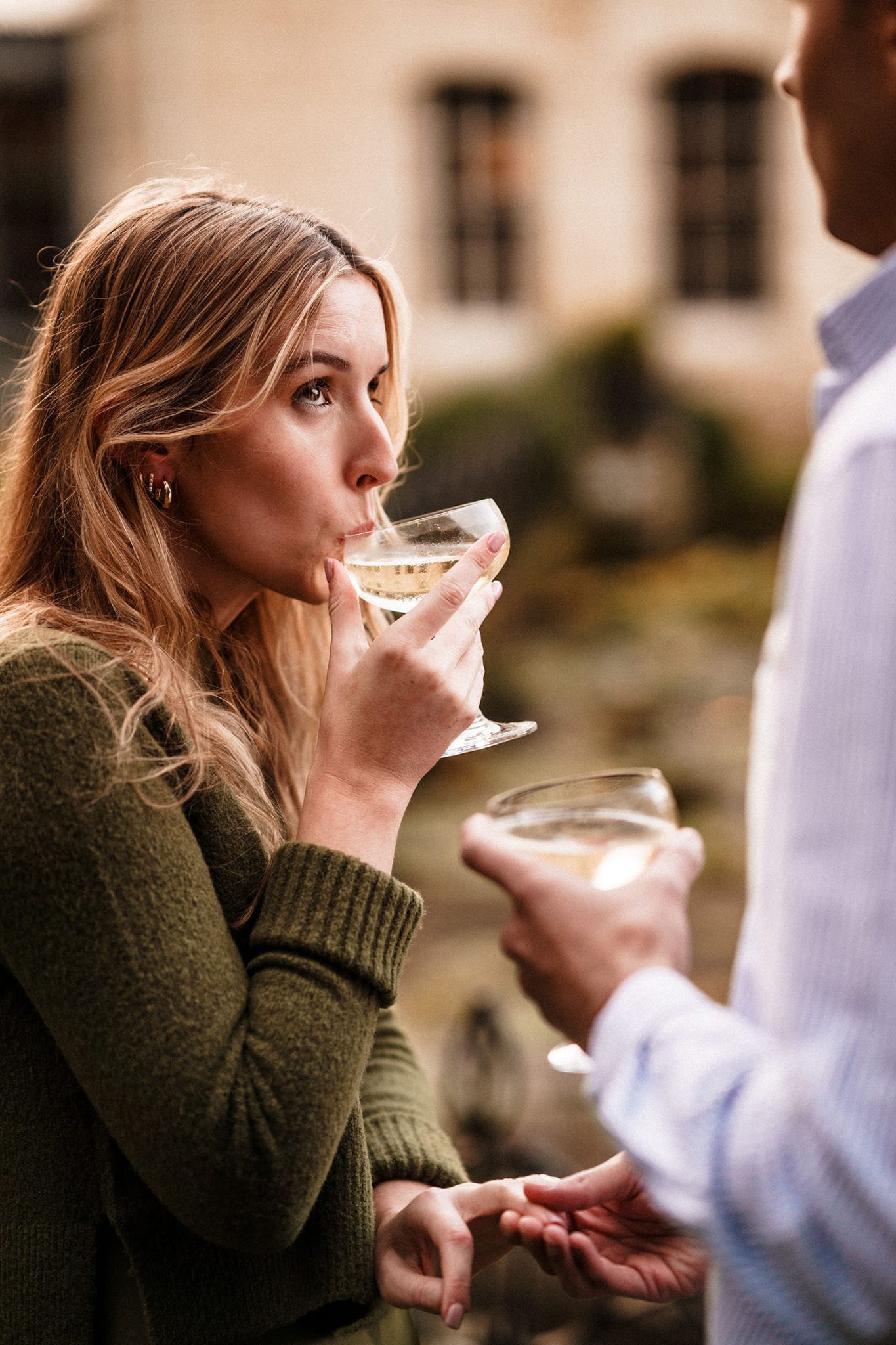 newly engaged fiance sips champagne in the cotswolds