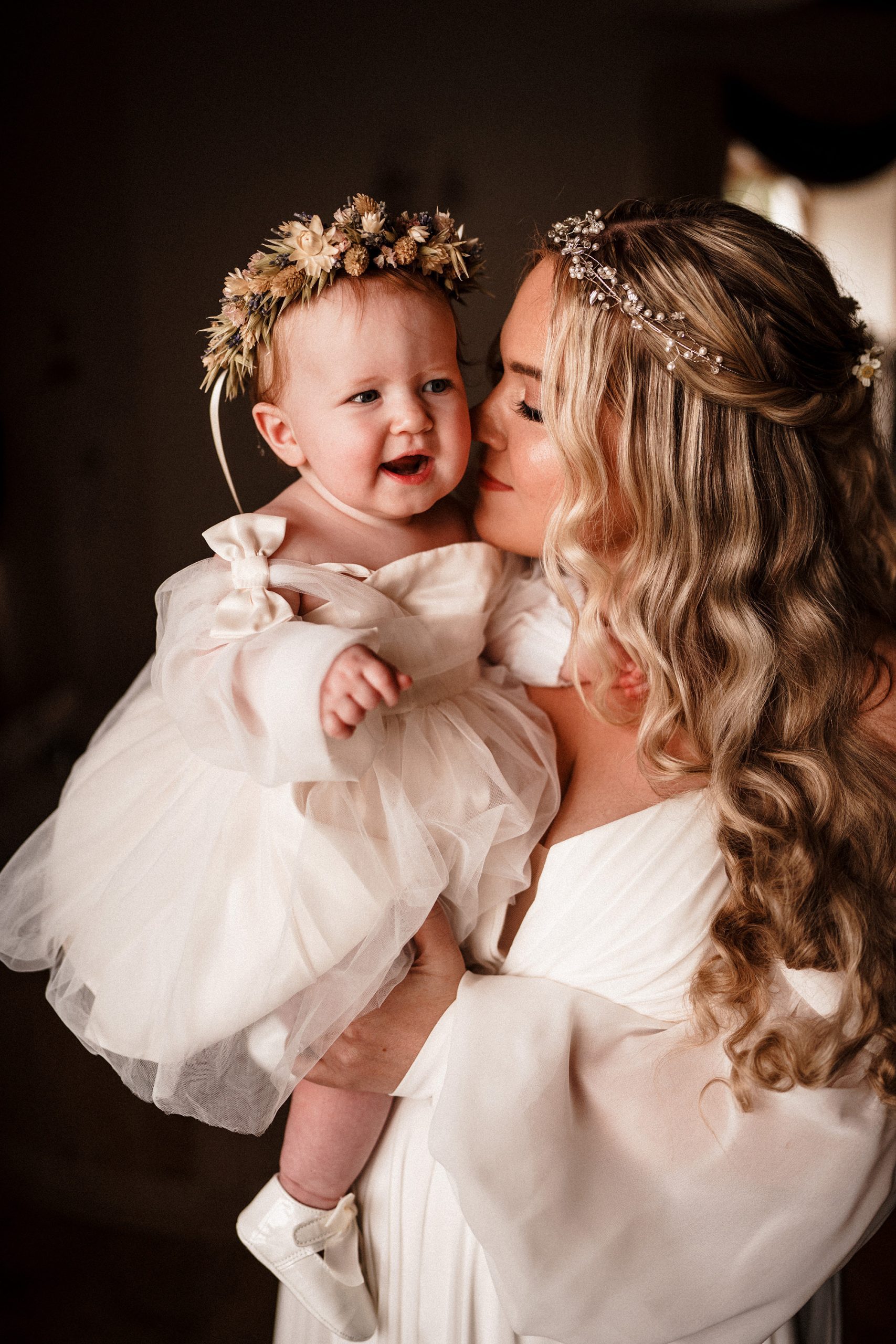 beautufl bride and her daughter moments before her Achnagairn Castle wedding in scotland
