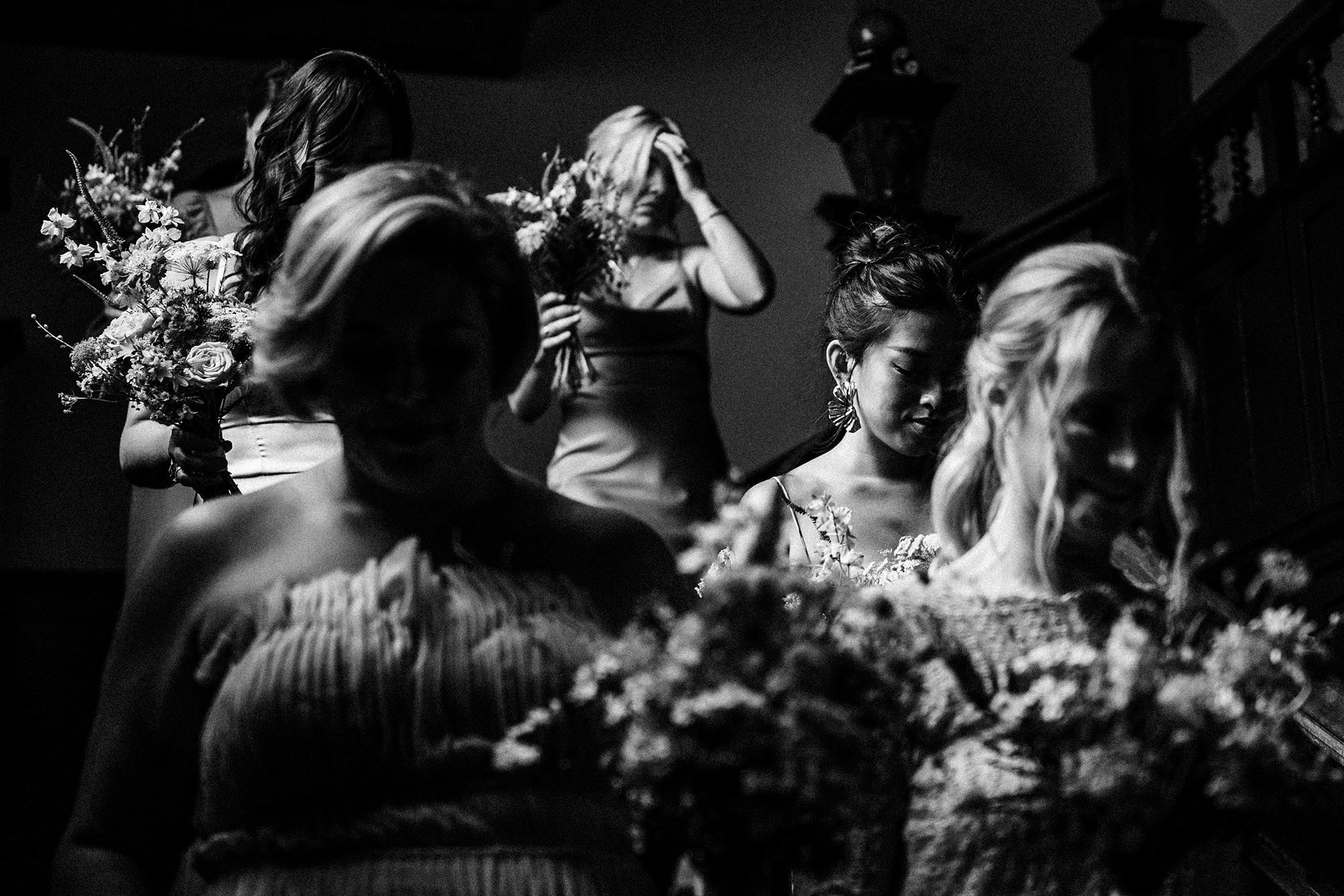 bridesmaids walking down the stairs at Achnagairn Castle for wedding ceremony