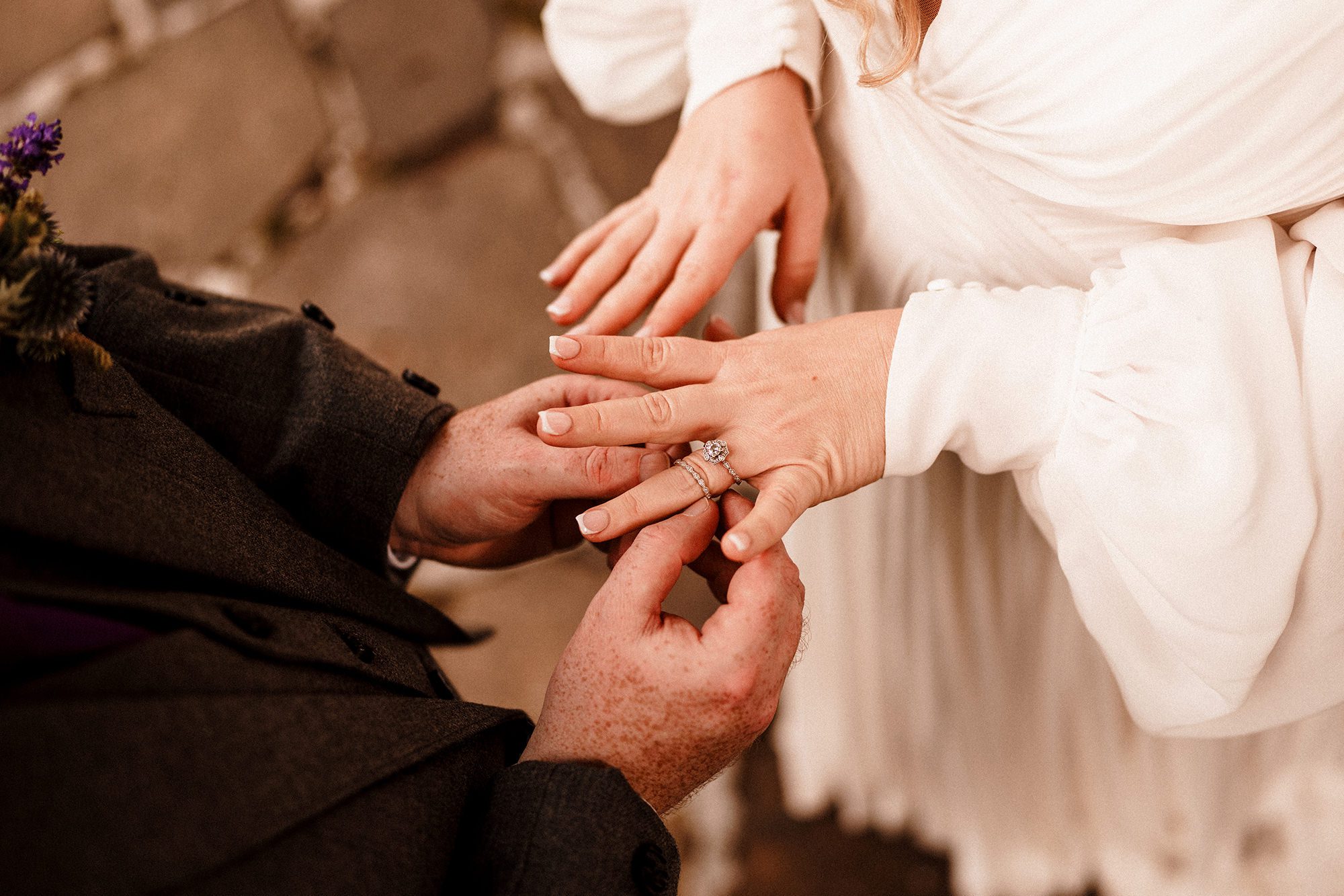 wedding band being put on brides finger during wedding in scotland