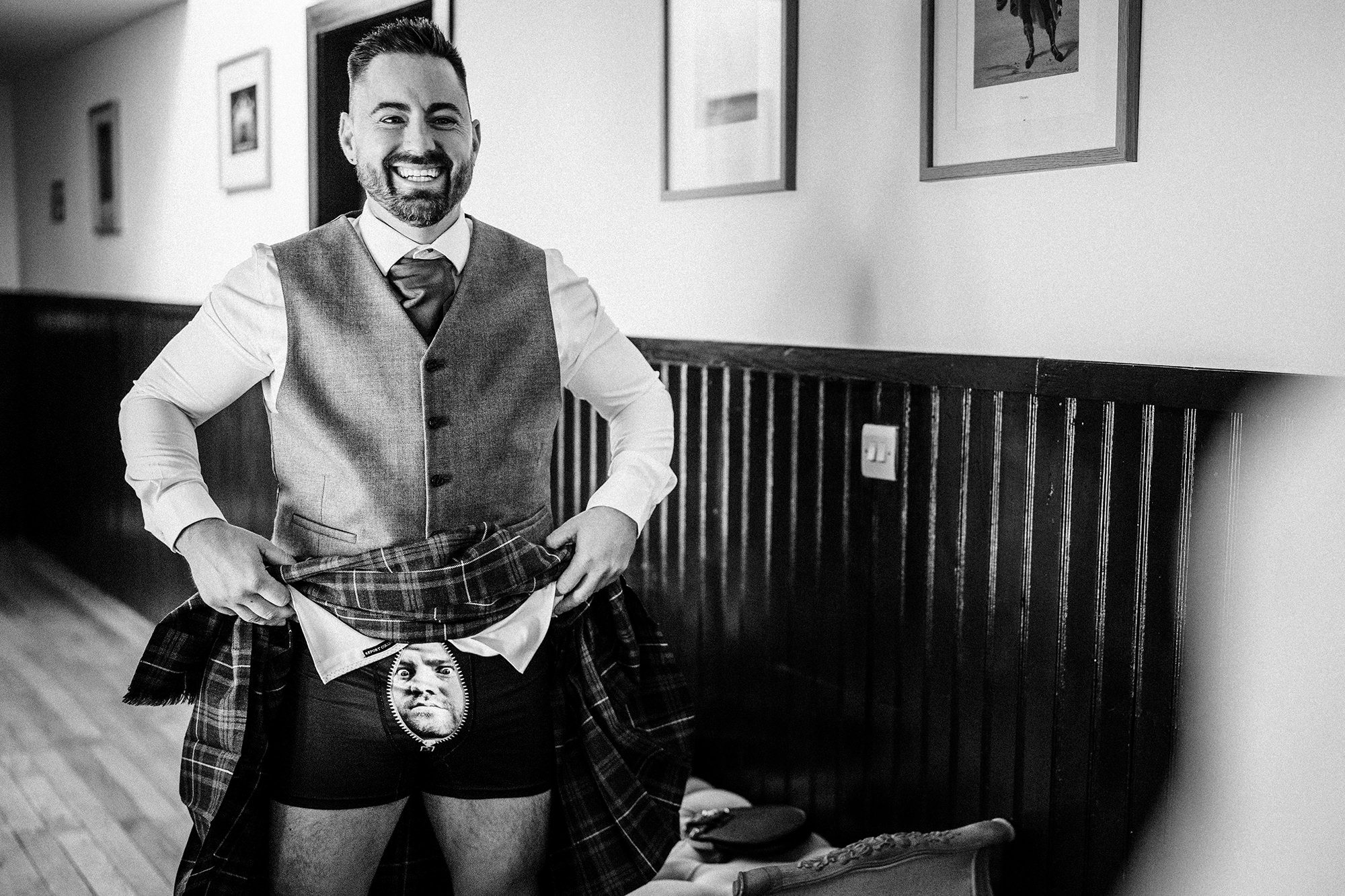 groomsman showing off his kilt at Achnagairn Castle