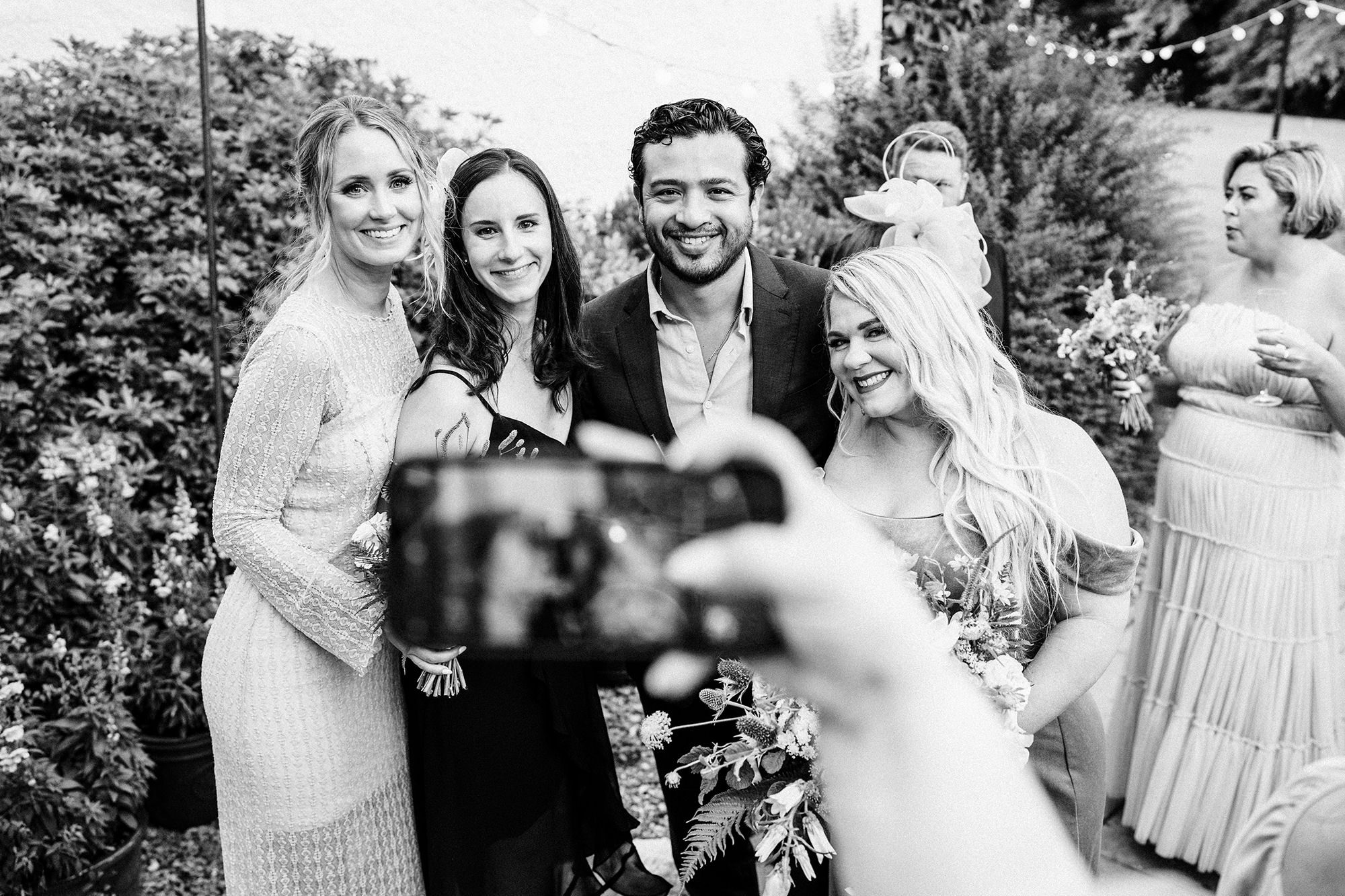 someone taking a photo of wedding guests at Achnagairn Castle