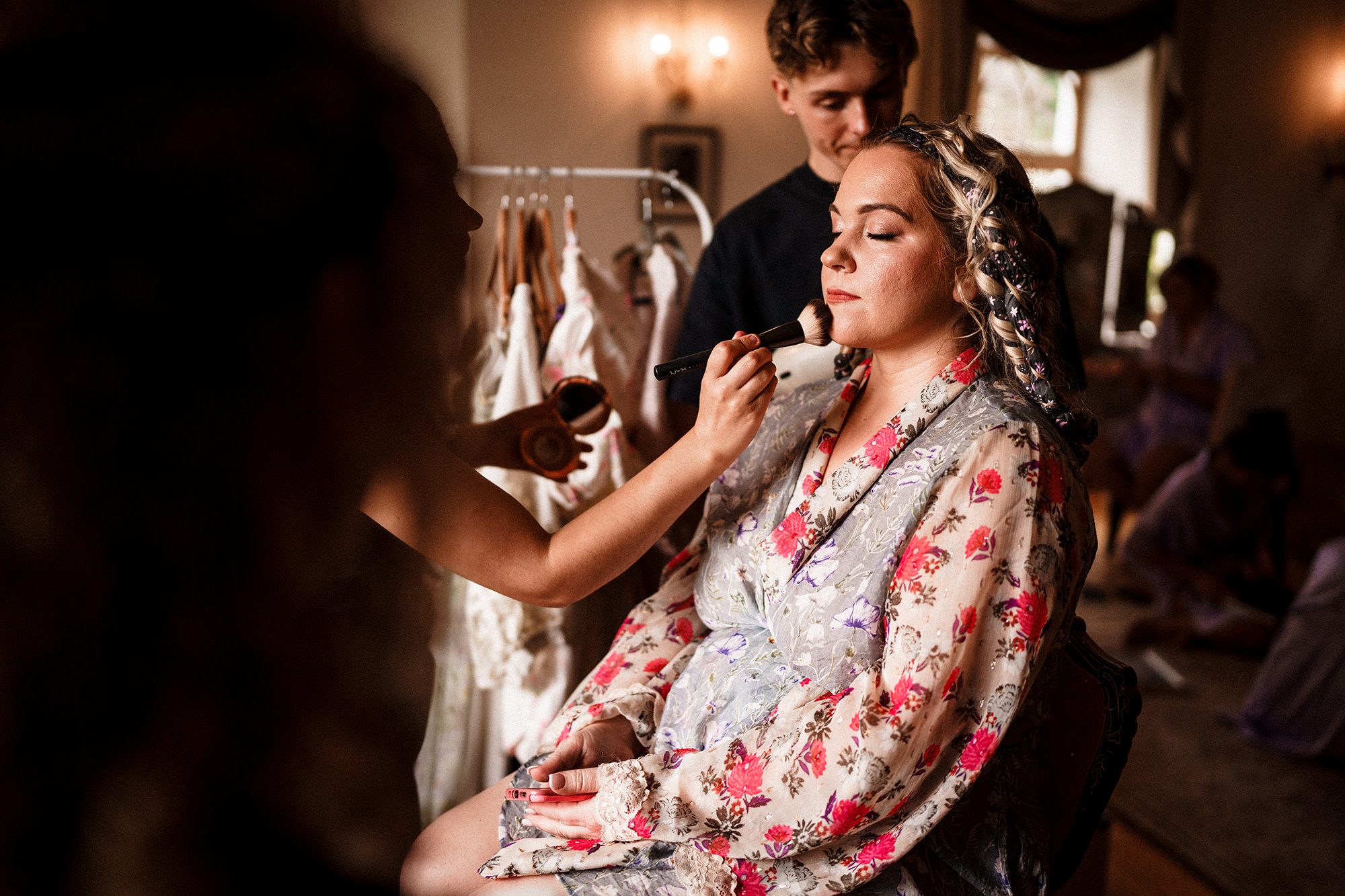 make up being applied to the bride at Achnagairn Castle