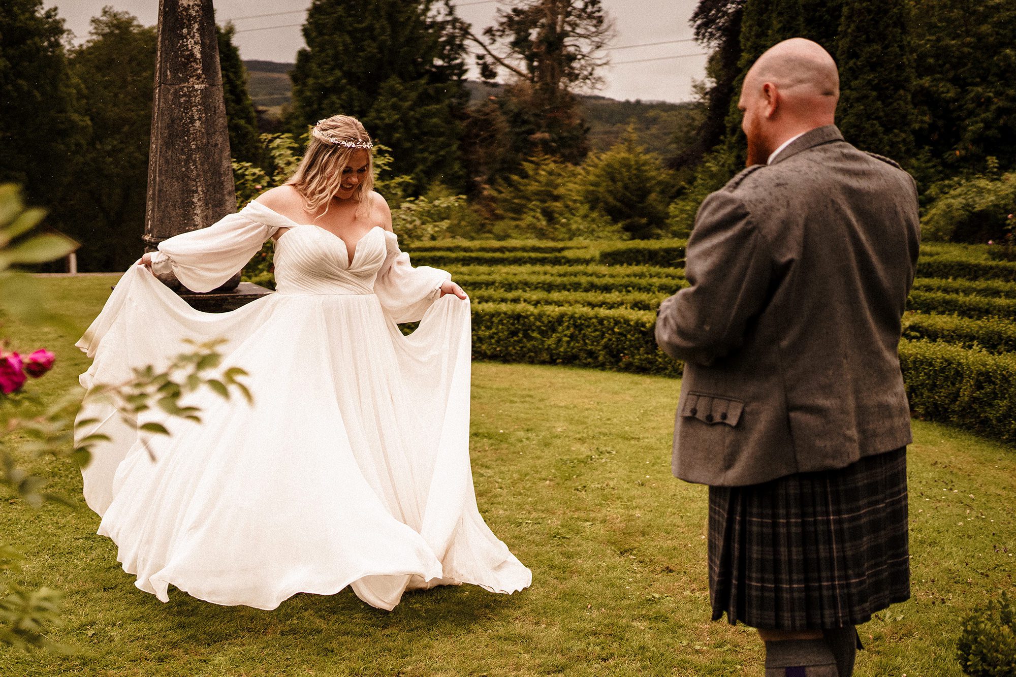 brdie showing off her dress to her husband