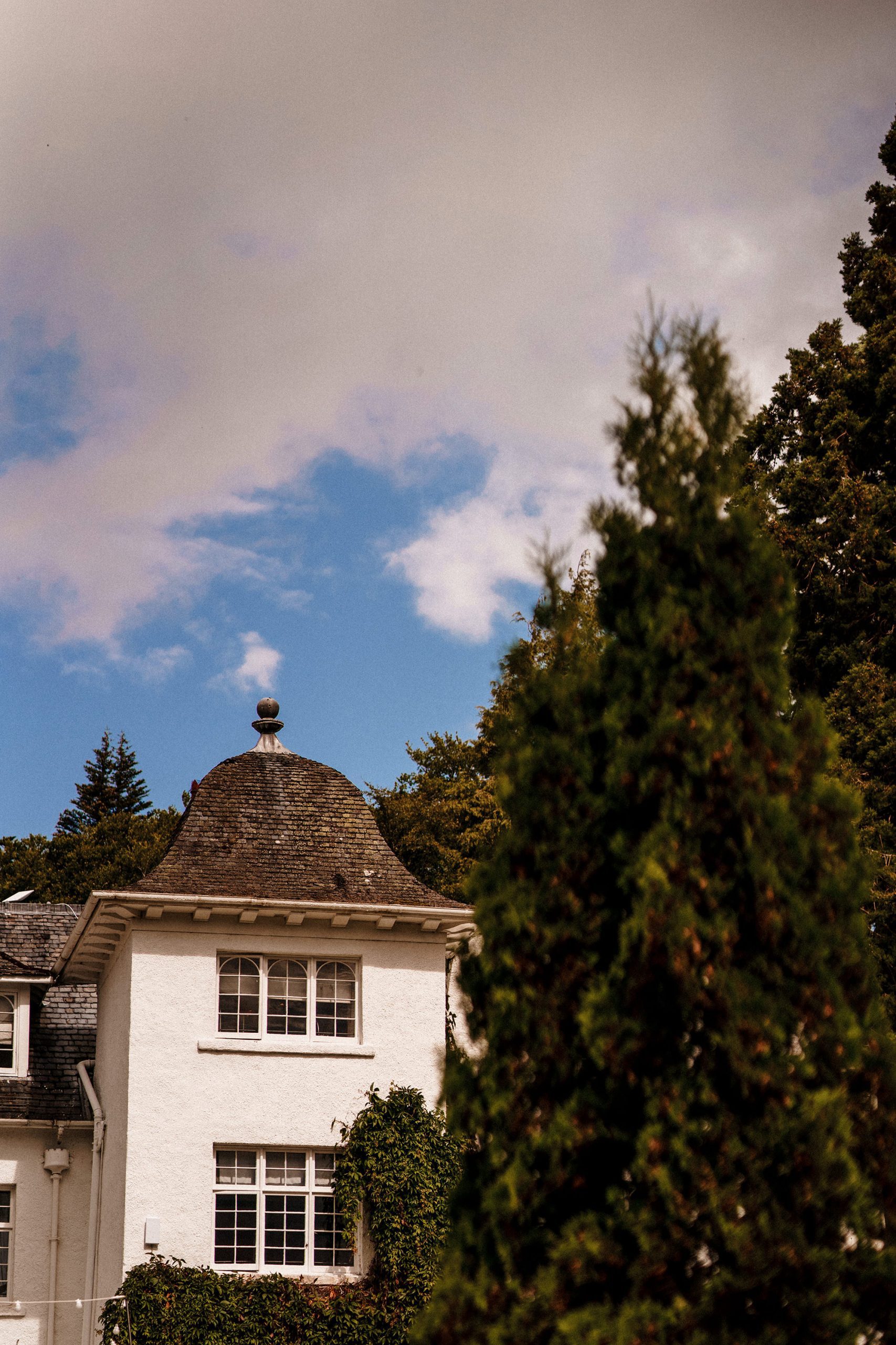 blue skies over Achnagairn Castle during summer wedding
