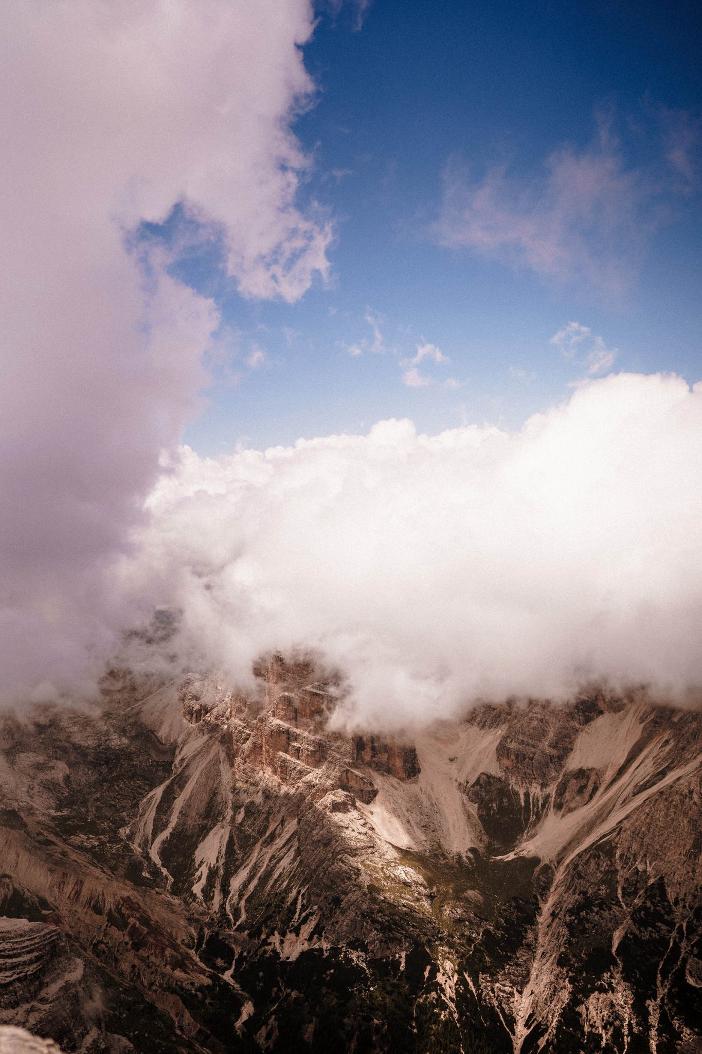 clouds over the mountains in the dolomites