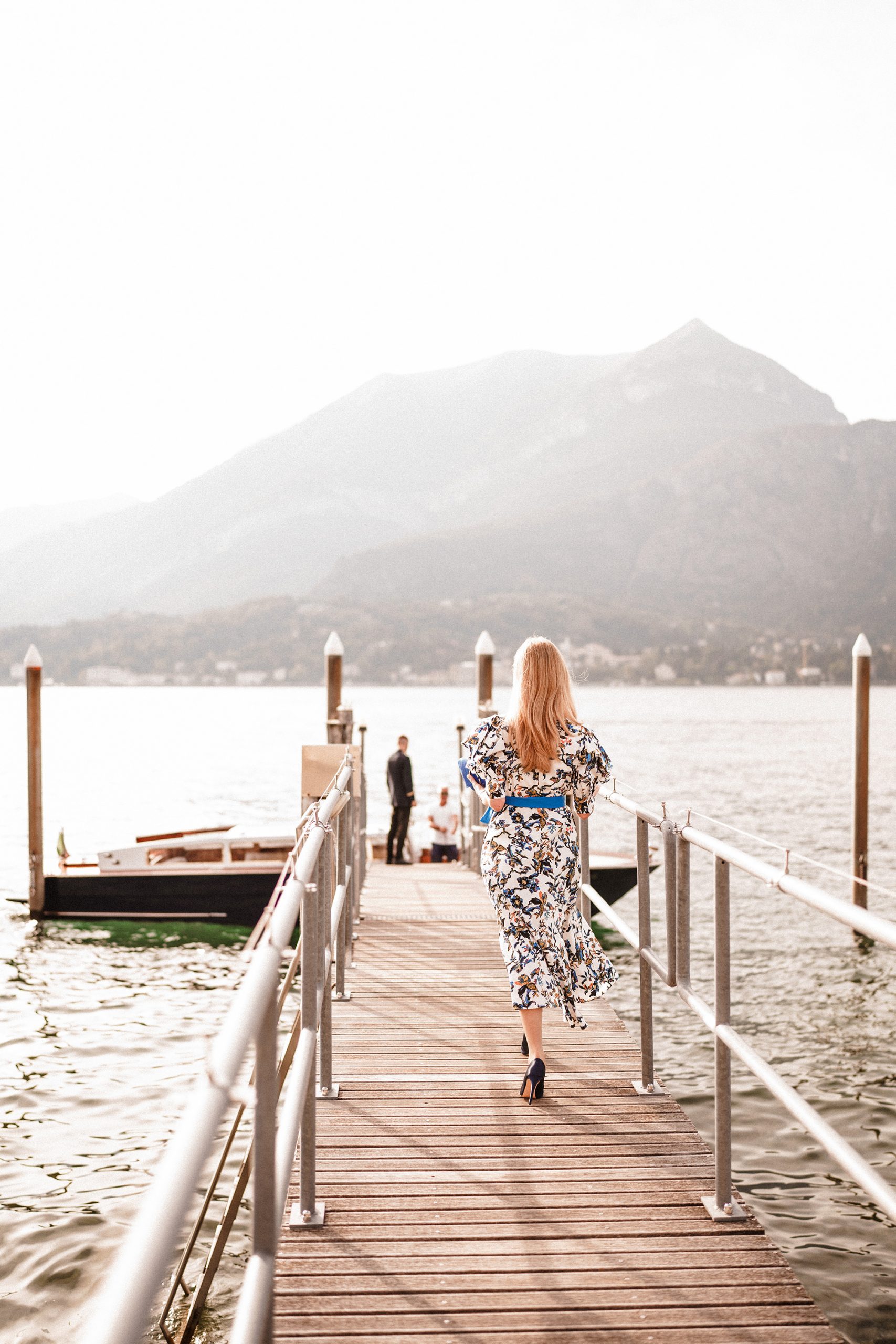 bride walking to boat on lake como